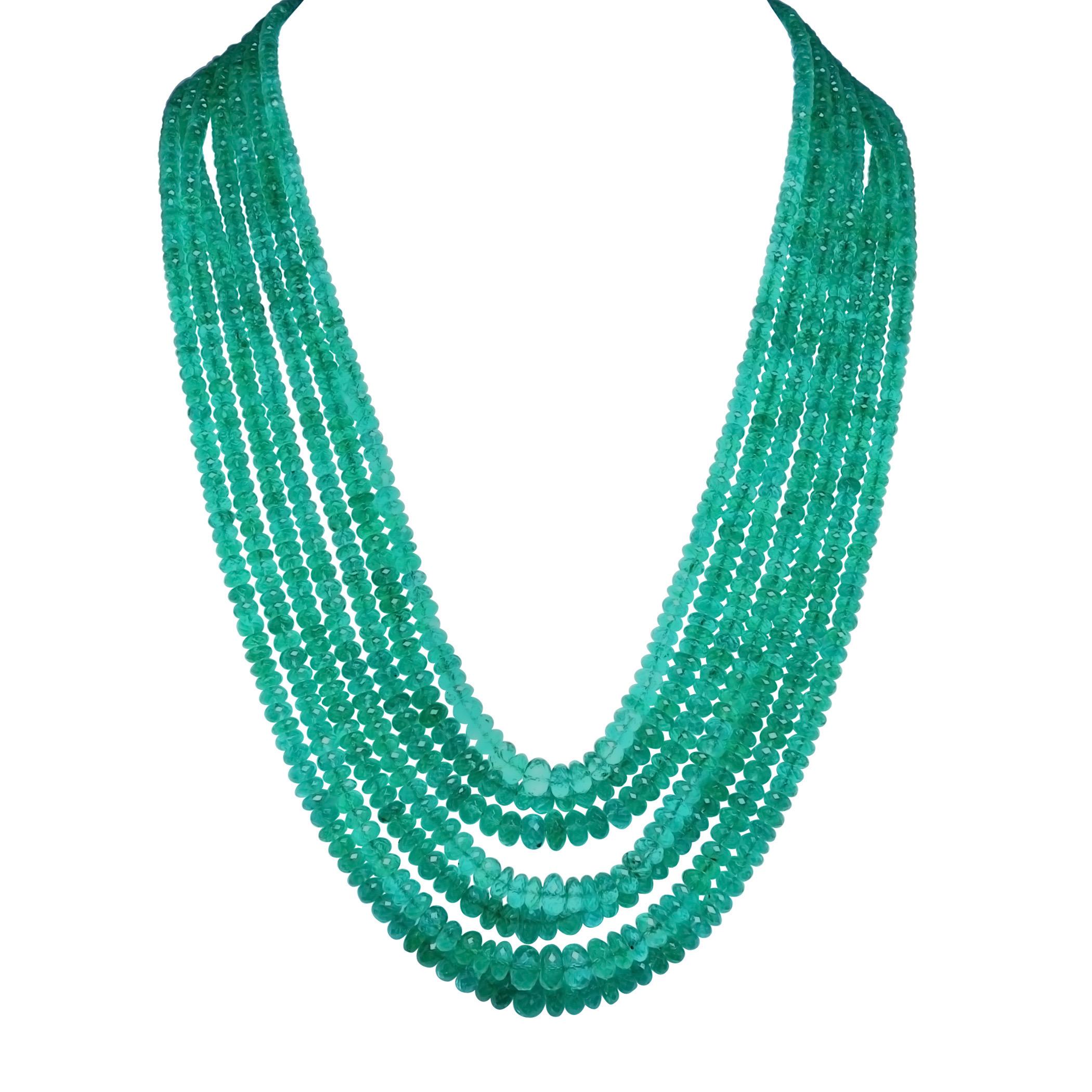 
750 Carat  Colombian Emerald Beads 7 Line  Necklace With Clasp 18 Kt Yellow Gold 
This spectacular Necklace   consisting of approximately 750 Ct  of fine beads.
 There are 7 rows of fine Colombian Emerald Beads  
Total carat weight of clasp is 7