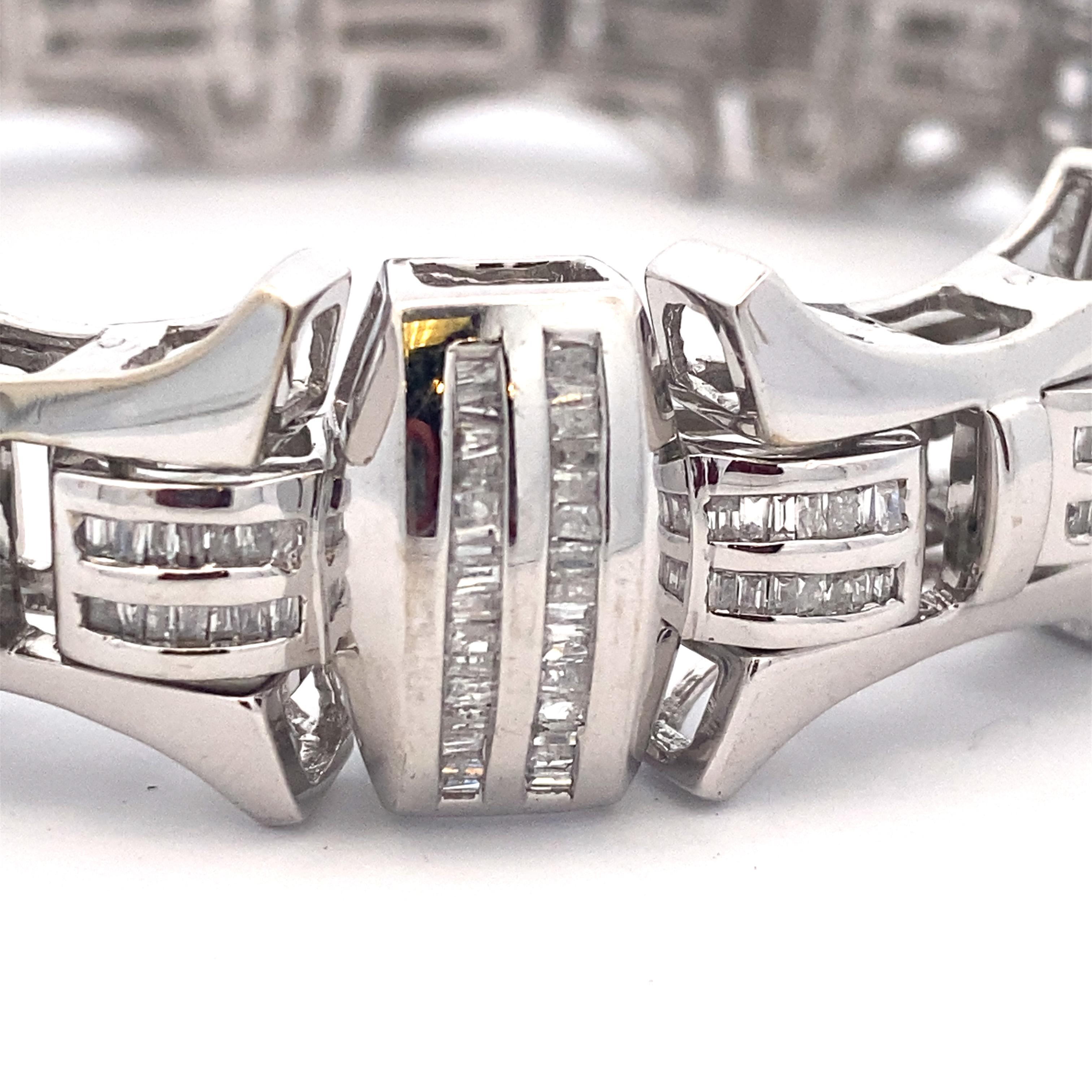 This bracelet looks fantastic on! 10k white gold with hundreds of bright baguette diamonds totaling approximately 7.50 carat total weight (measured in the setting). 8.5
