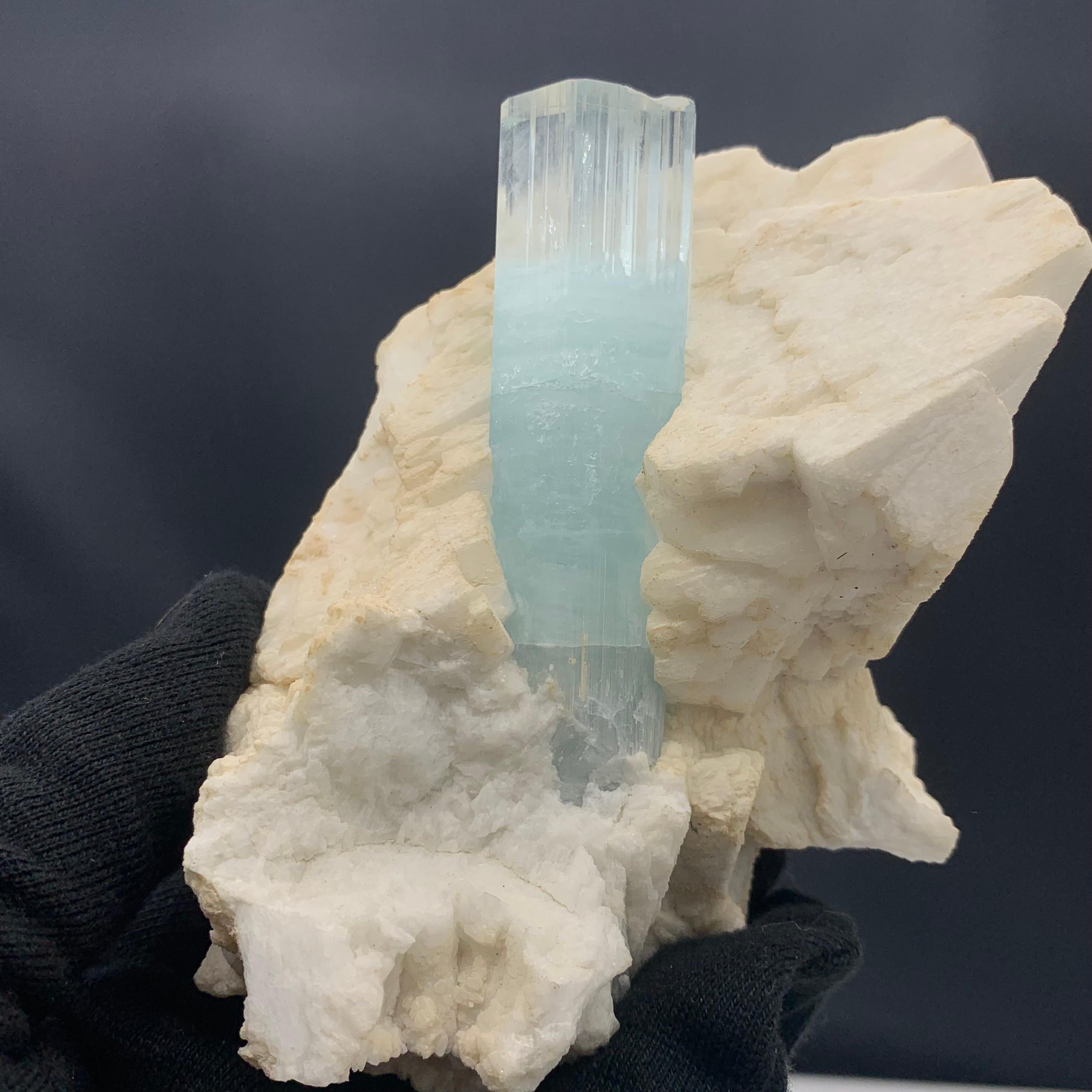 750 Gram Attractive Aquamarine Specimen With Attach with Feldspar From Pakistan 
Weight: 750 Gram 
Dimension: 13.5 x 9.7 x 5.6 Cm 
Origin: Skardu, Pakistan 

Aquamarine is a pale-blue to light-green variety of beryl. The color of aquamarine can be