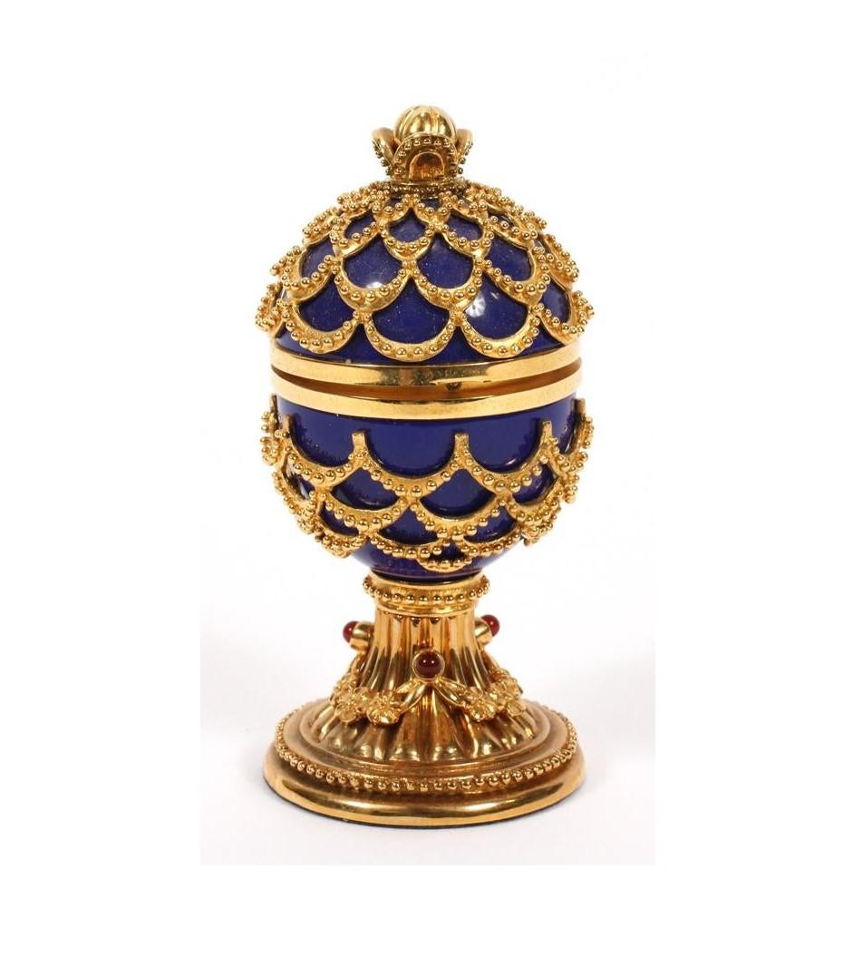 The Following Item we are offering is A Magnificent Beautiful French Lapis Lazuli Faberge Egg Clock. Beautifully done with Fine Gold Gilt Bronze and Intricate Scrolled Detail and Outstanding Handcut Ornate Accent Detailwork and Gorgeous Ruby