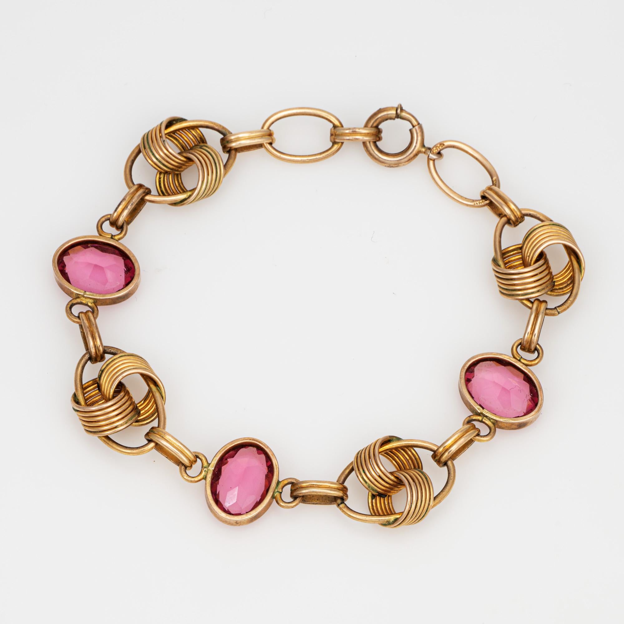 Stylish and nicely detailed vintage letter pink tourmaline bracelet crafted in 14 karat yellow gold (circa 1960s). 

Faceted oval cut pink tourmaline measure 11mm x 9mm (estimated at 2.50 carats each - 7.50 carats total estimated weight). The pink