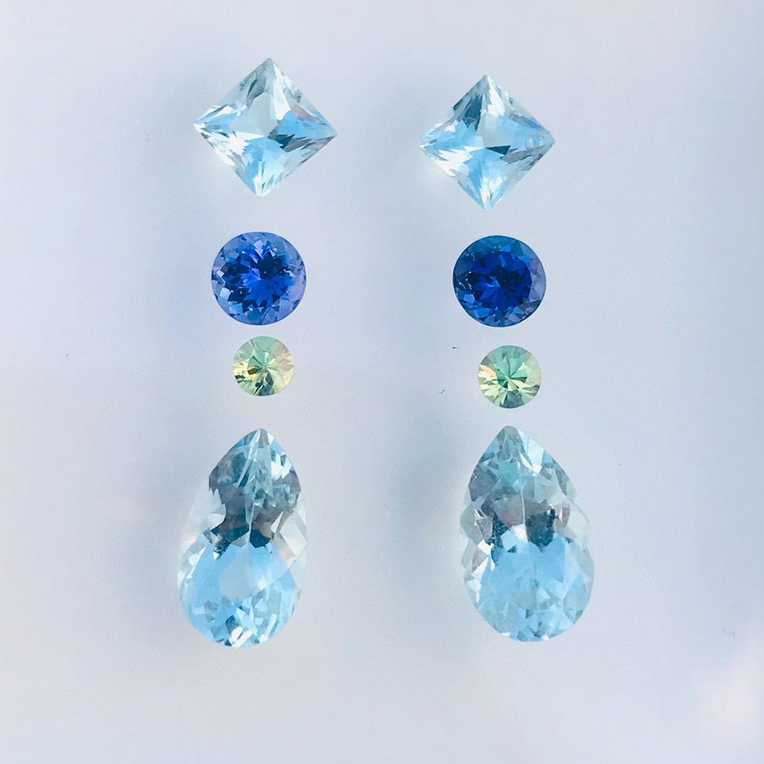 Aquamarine Tanzanite Demantoid (green garnet ) so beautiful set for earrings cutting by 

F101
WB Gems
Name : Aquamarine Tanzanite Demantoid 
Weight : 7.51 Carats 
Size: AQ 6.5*11.3*8mm/TZ 5mm/ Dm 3.5mm
Clarity:Clean
Cutting:By WB Gems

