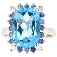 Bague en or blanc 14 carats avec topaze bleue de 7,52 carats, saphirs et diamants