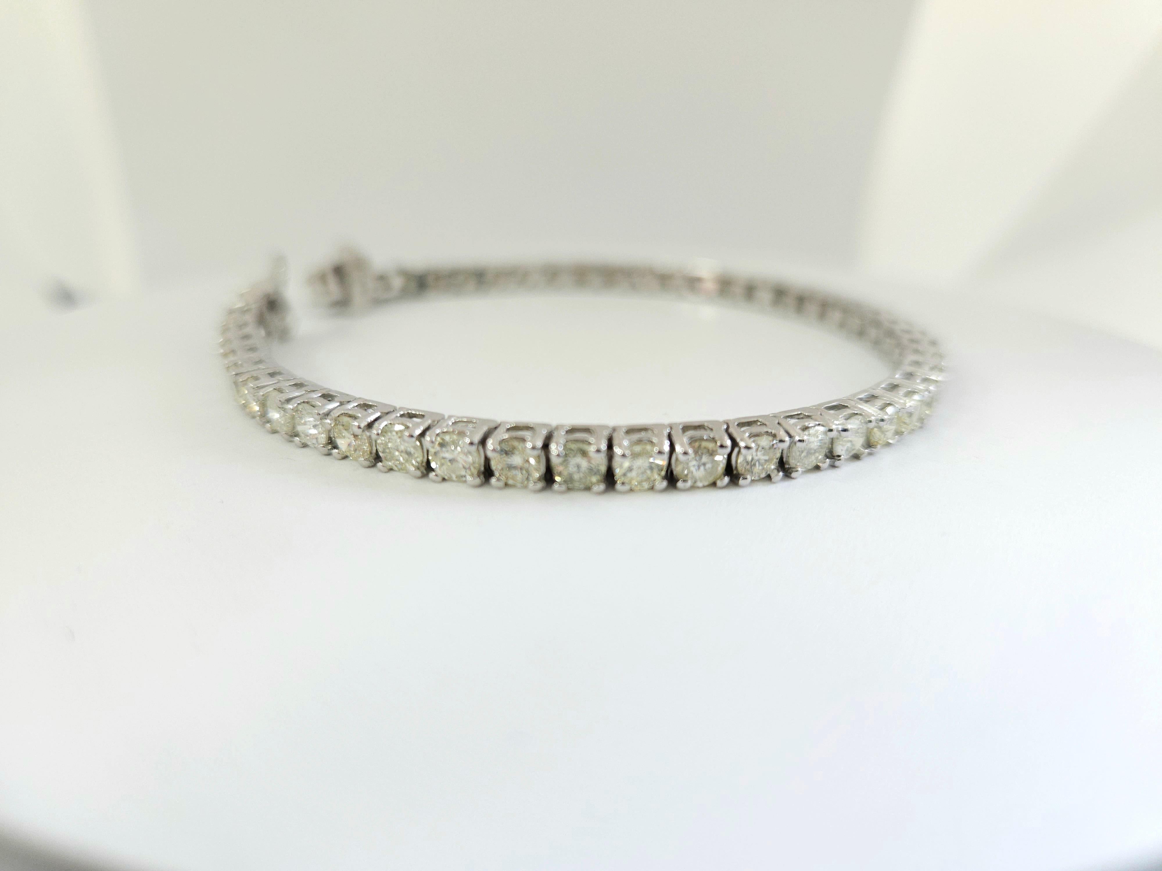 Natural diamonds tennis bracelet round-brilliant cut  14k white gold. 
7 inch. Average Color J, Clarity I 3.70 mm wide,48 pcs, 14.22 grams very shiny don't miss.

*Free shipping within U.S*


