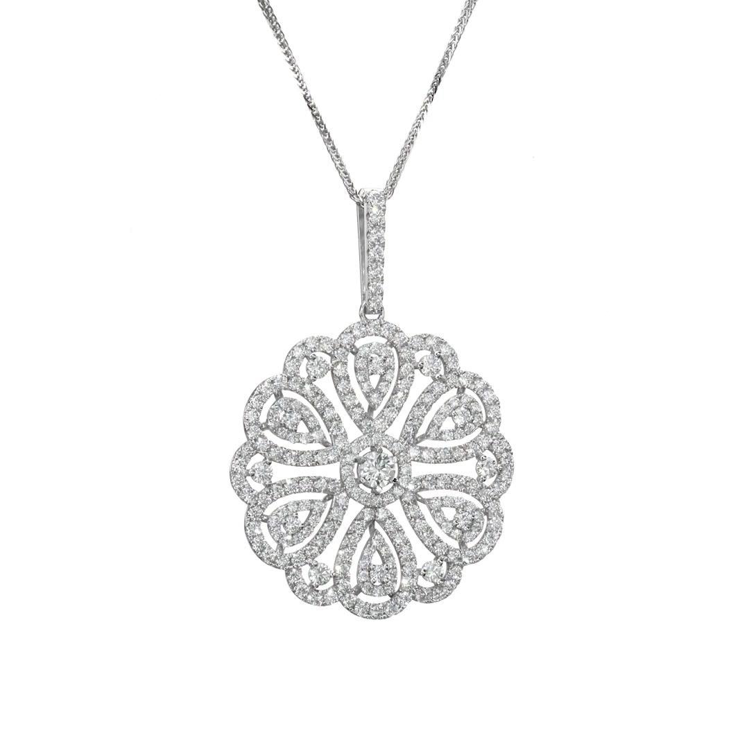 Hand Crafted 7.52 Carat Diamond Cluster Pendant is set with 122 brilliant cut round diamonds and mounted on 18K white gold. The one of a kind pendant is done with detailed craftsmanship and stars a 0.52 Carat F/ SI as a center diamond. 
The pendant