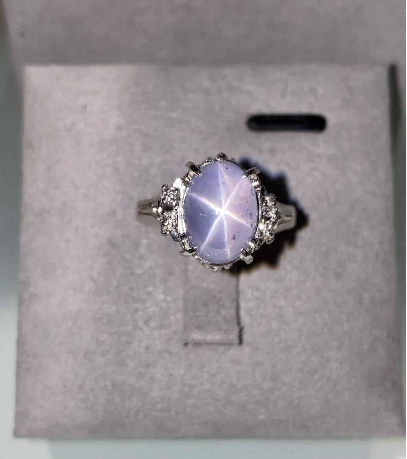This is a very simple design aiming to give the Start Sapphire Cabochon as much attention as possible. The clearer the asterisks is on the star sapphire the more valuable it is.  

Main Star Sapphire weight is 7.53ct
Total Natural Diamond weight is