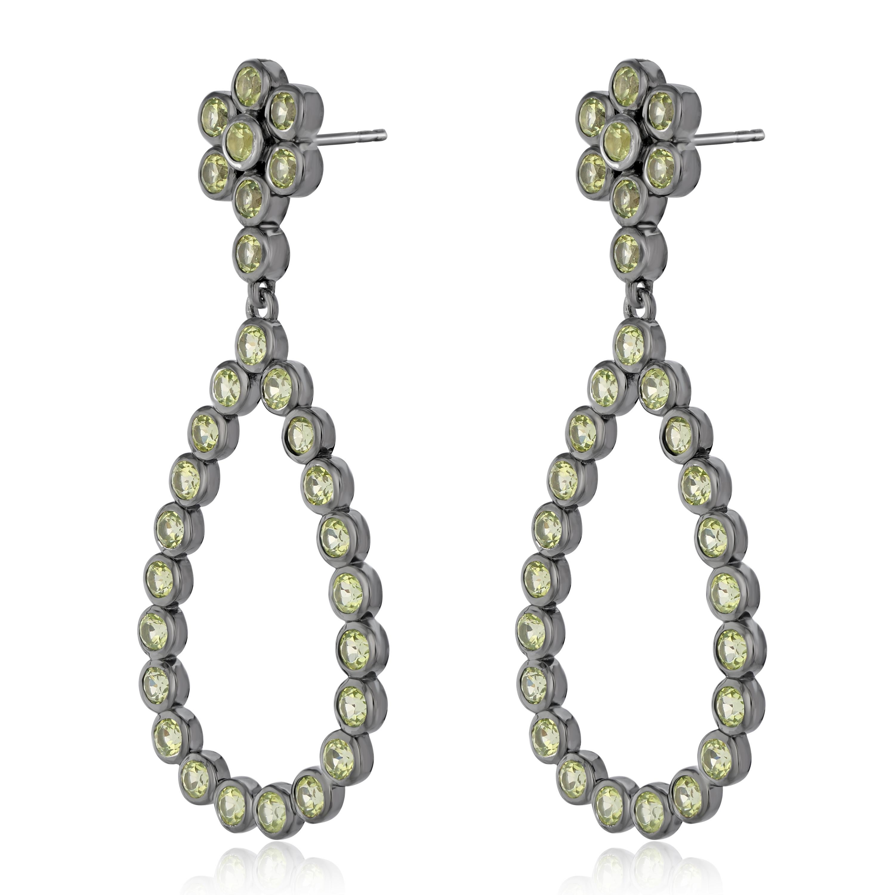 Known to be the birthstone for the month of august, peridot protects the wearer from sadness. These women's earrings feature 3 mm peridot 7.54 Ct  arranged in a floral and open teardrop design. These earrings are crafted in genuine and nickel free