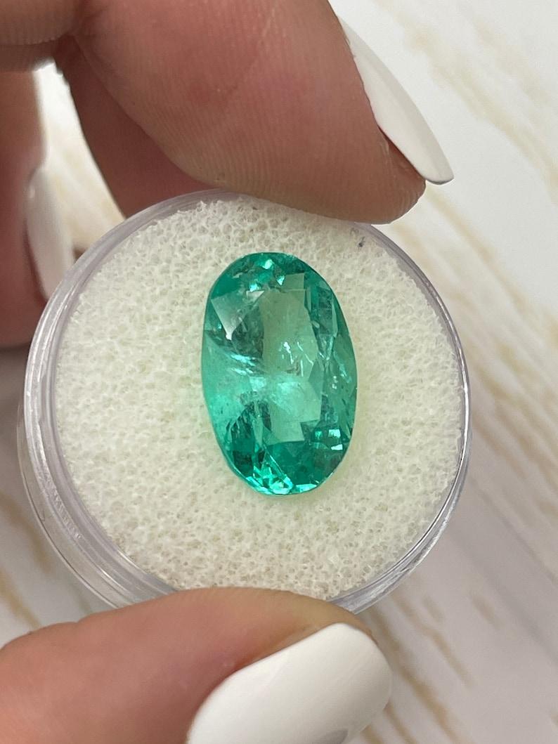 Women's or Men's 7.55 Carat Bluish Green Colombian Emerald Oval Cut - May Birthstone Gem For Sale