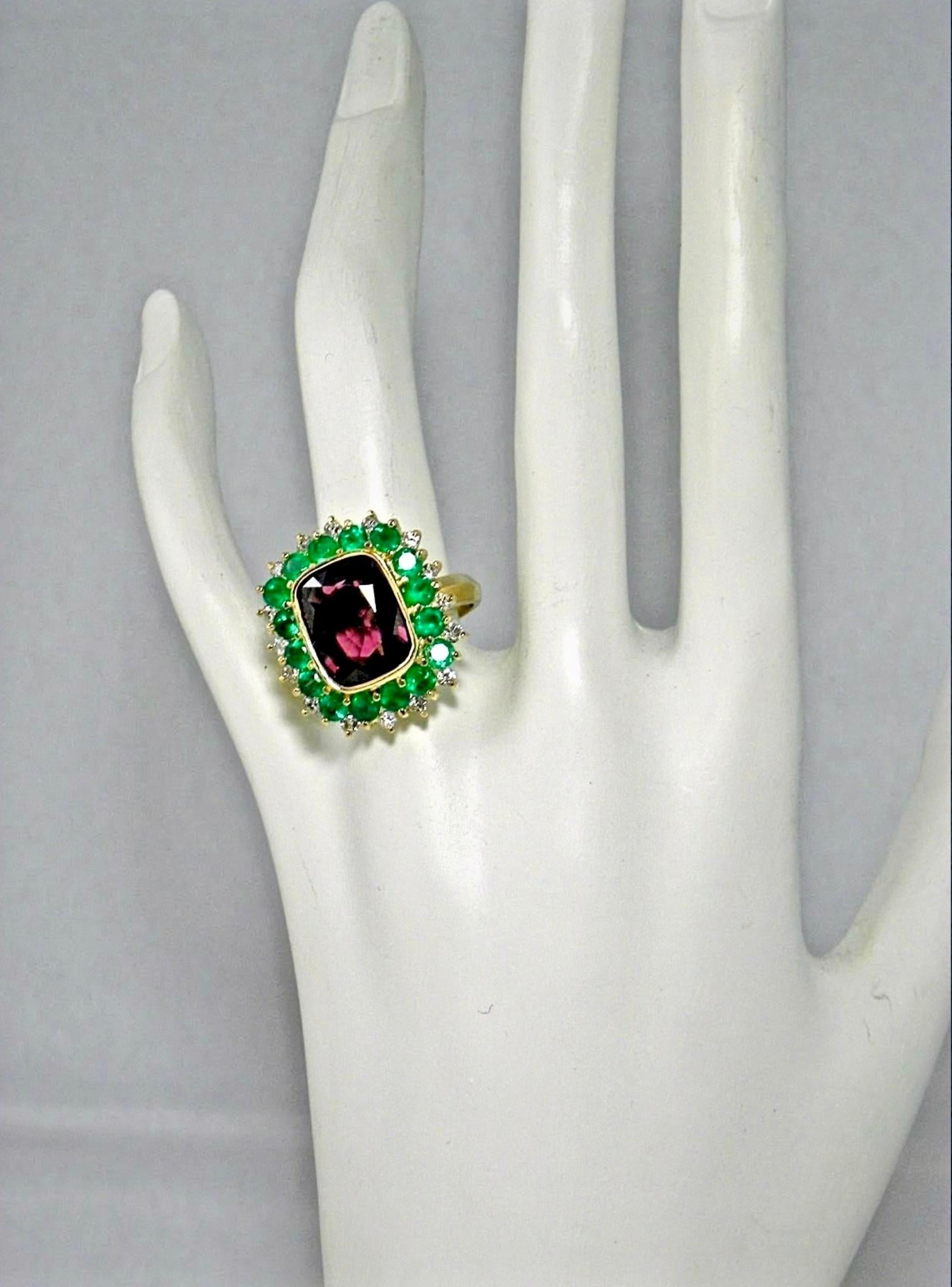 Stunning One-of-a-Kind- Fine Spinel, AAA Colombian Emerald and Diamond Cocktail Engagement Ring 18 Karat Rich Yellow Gold
Natural Burma Spinel Cushion Cut,  Red Wine(Raspberry) Color/ Clarity VS
Total Spinel Weight: 5.10 Carats Huge
Second Stone: