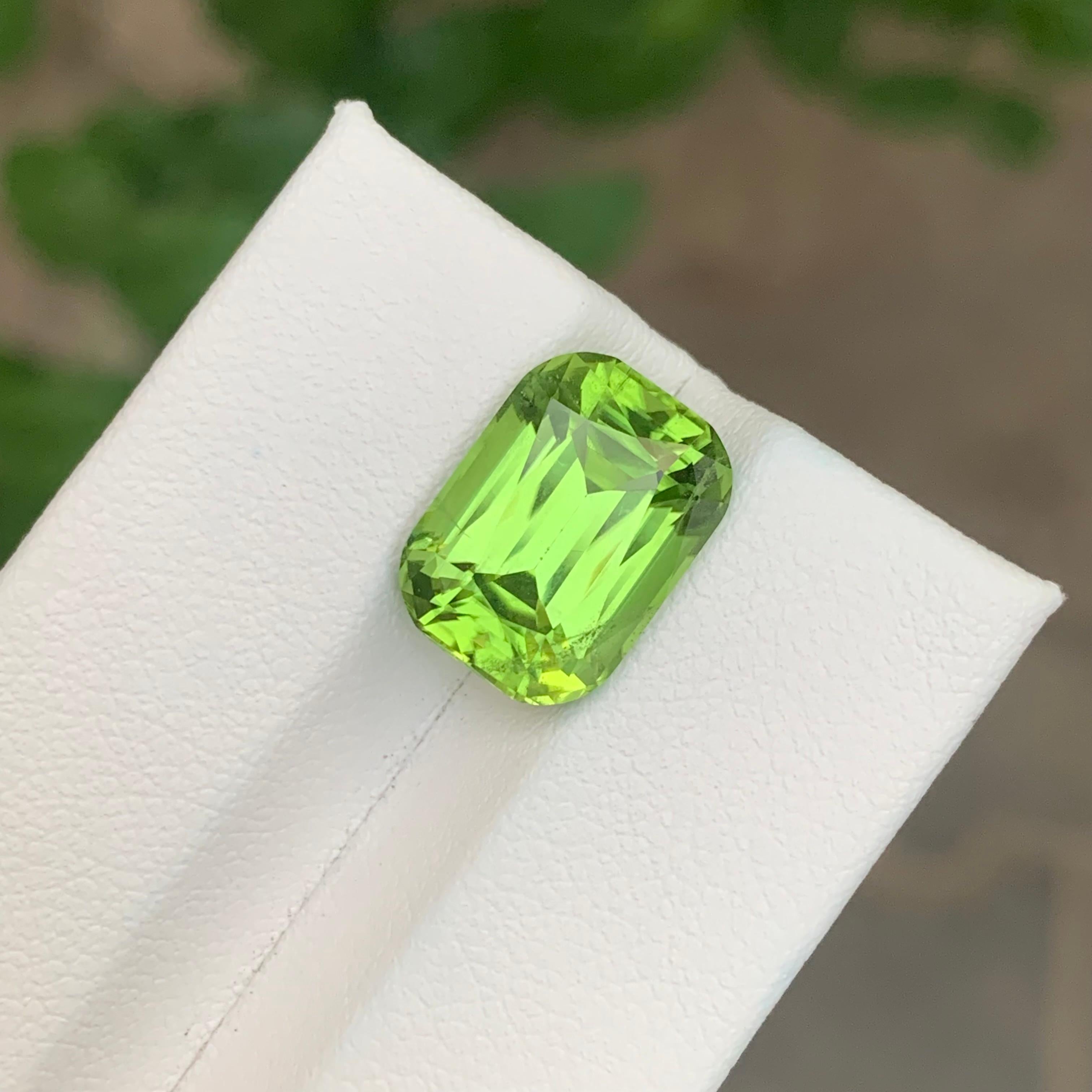 Loose Peridot 

Weight: 7.55 Carats
Dimension: 13.1 x 9.5 x 7.4 Mm
Origin: Pakistan 
Shape: Long Cushion 
Treatment: None
Certificate: On Demand
.
Peridot, often referred to as the “gem of the sun,” is a captivating gemstone known for its vibrant