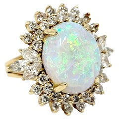 Vintage 7.55 Carats Total Opal Cabochon and Diamond Halo Ring in 14 Karat Yellow Gold