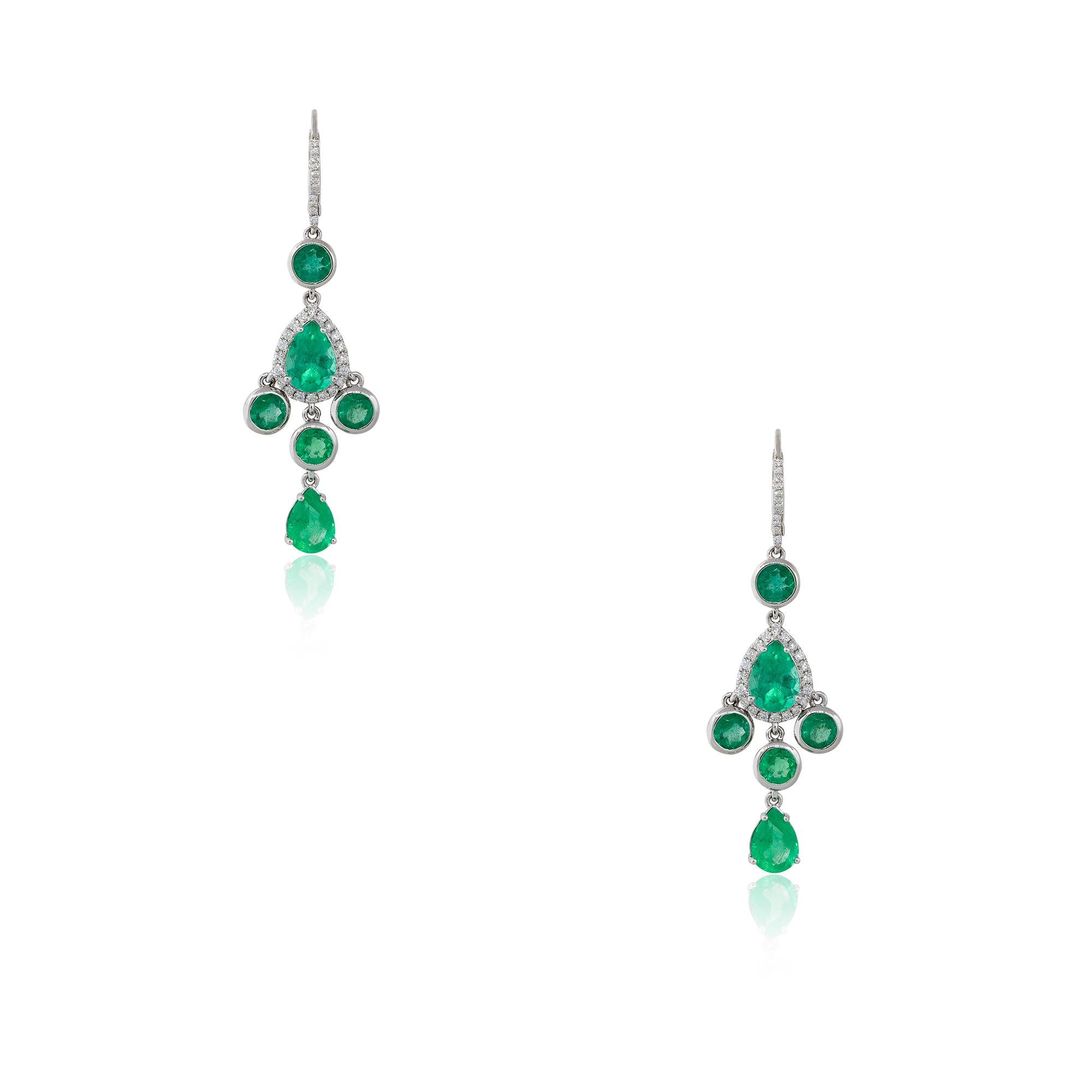 18k White Gold 7.56ctw Emerald and Diamond Halo Drop Earrings

Material: 18k White Gold
Gemstone Details: Approximately 7.56ctw of Pear shaped and Round cut Emeralds. There are 12 Emeralds total
Diamond Details: Approximately 0.39ctw of Round