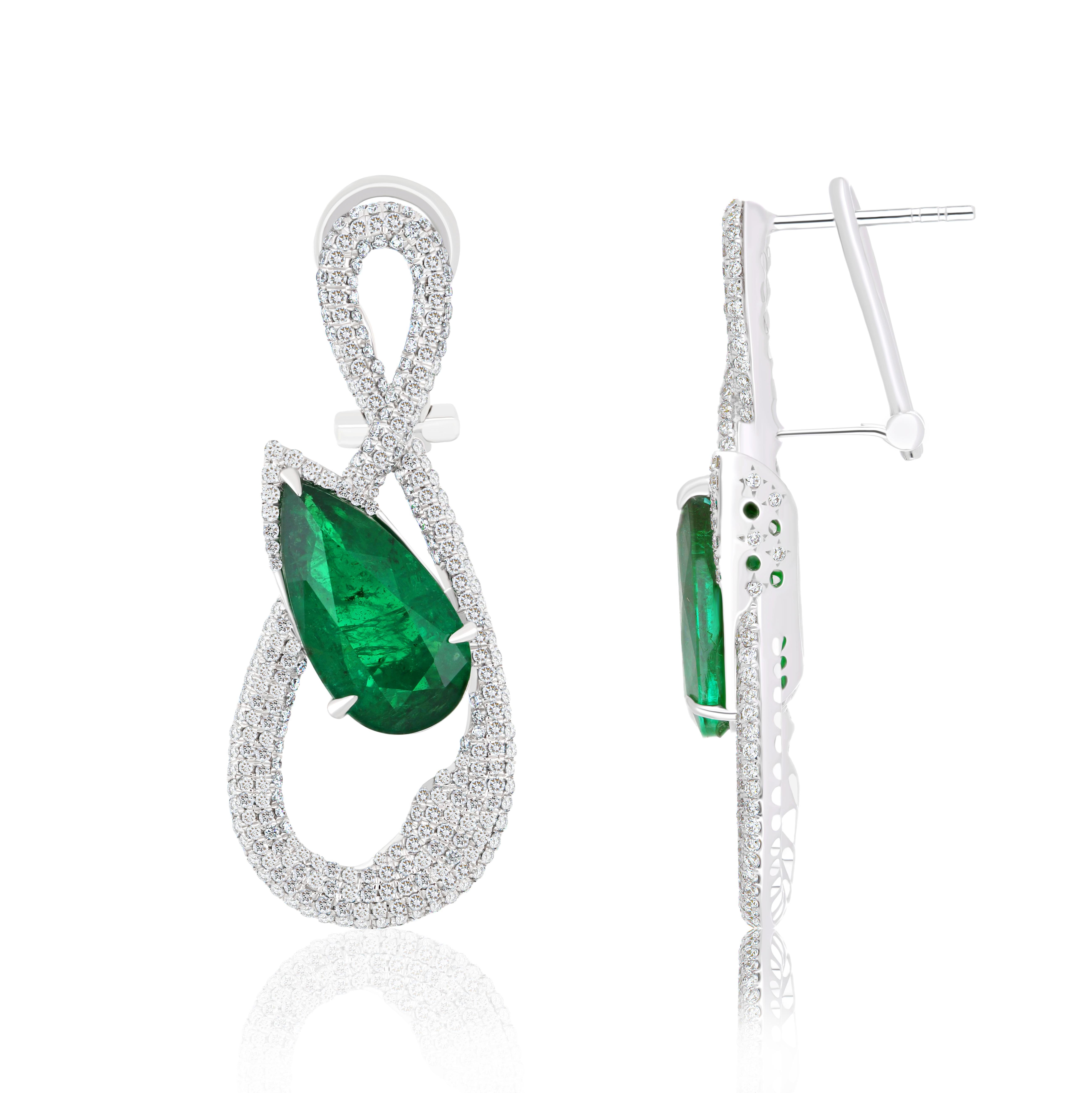  Elegant and Exquisitely detailed White Gold earrings, with 7.56 CT's (total approx.) Emerald cut in Elongated Pear Shape, and accented with micro pave Diamonds, weighing approx.   1.86 CT's. (total approx.). total carat weight. Beautifully