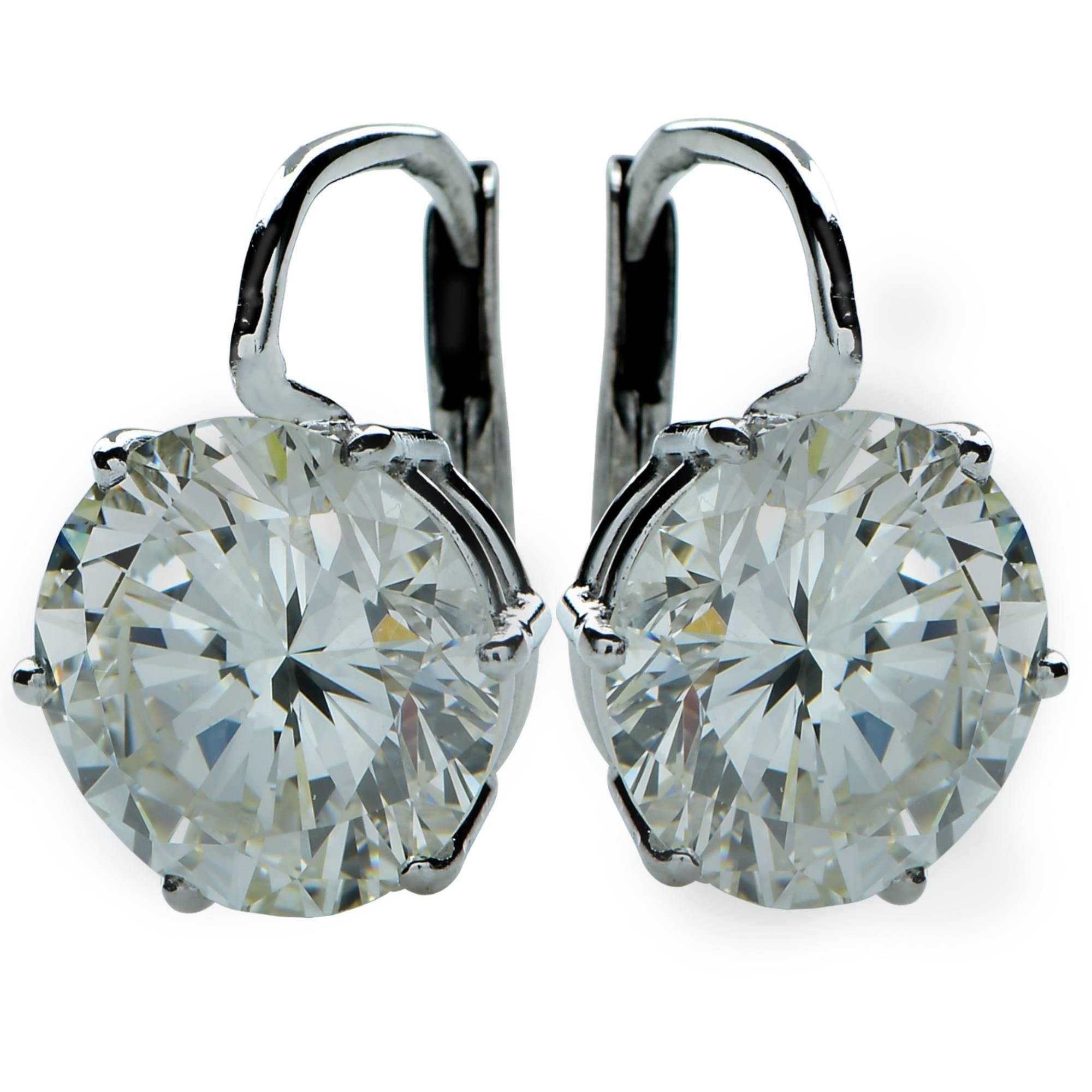 These earrings are sure to put an everlasting smile on her face. They are simple yet elegant and can be worn every day or out at a ball. Boasting 7.57cts total weight of round brilliant cut diamonds- K,M color, SI2-VVS2  clarity. They are beautiful