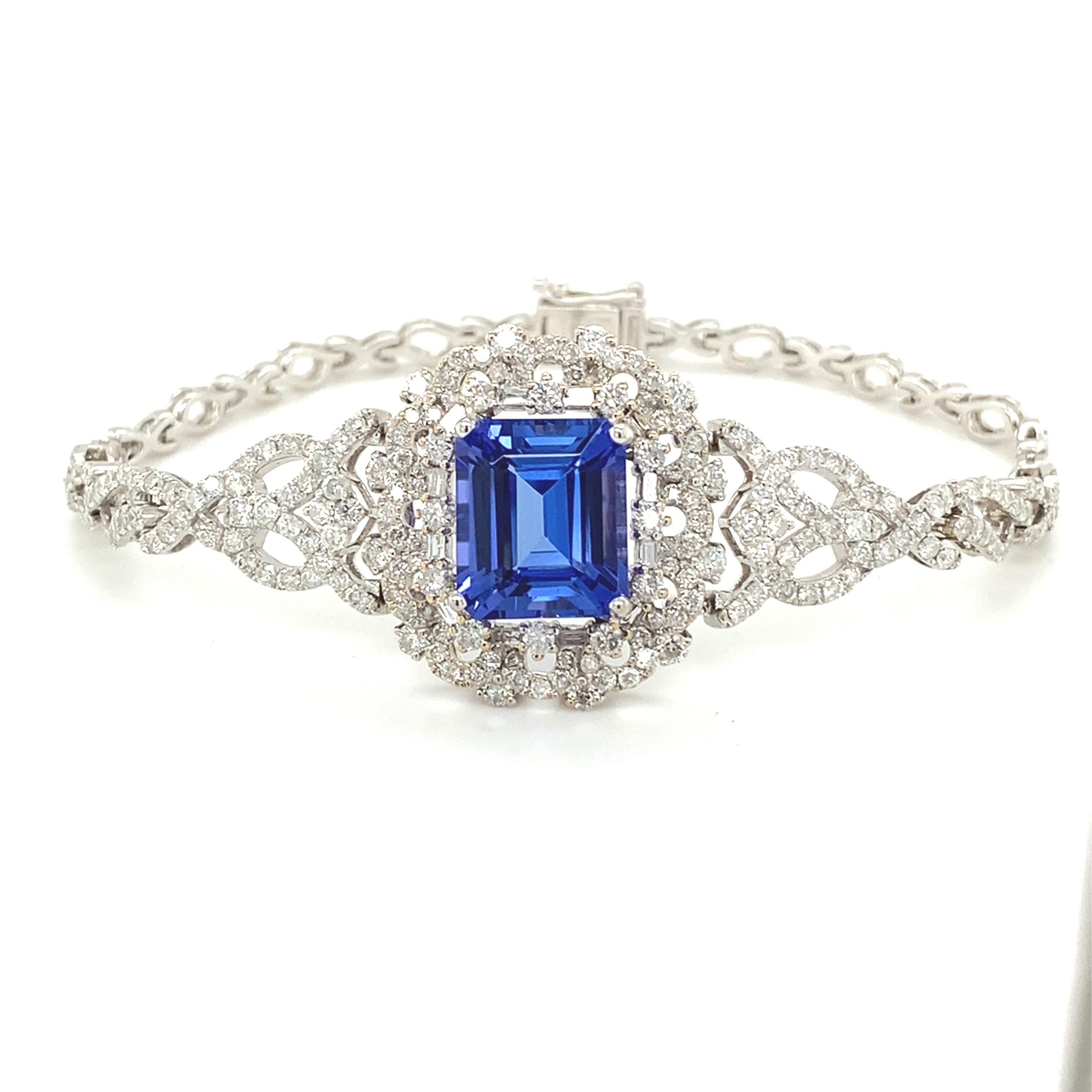 This breathtaking 7.57-carat Tanzanite diamond bracelet features a vivid violet-blue Tanzanite center stone, beautifully framed by 3.66 carats of sparkling diamonds. The intricate design enhances its elegance, while the bracelet is expertly crafted