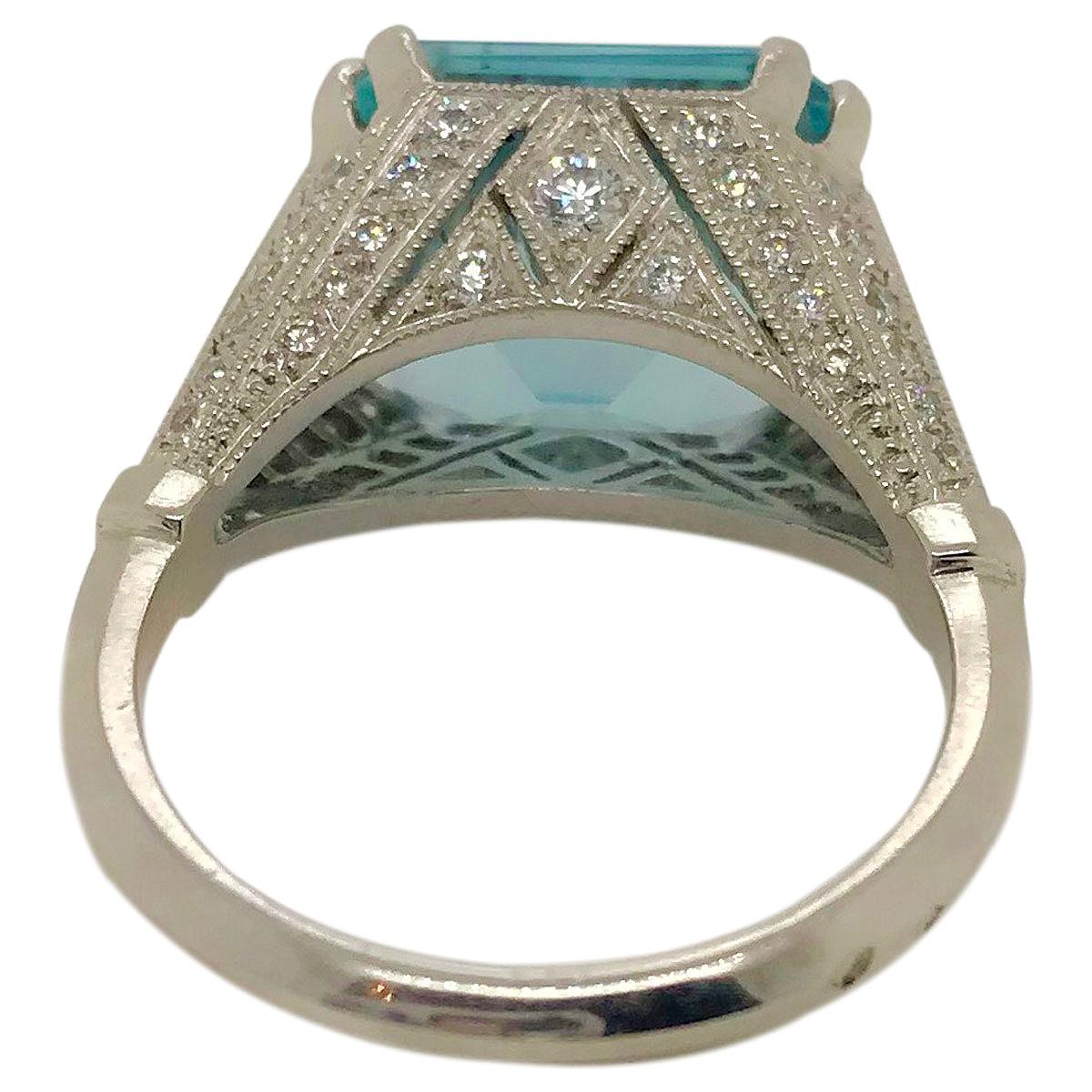 This ring is totally dreamy, the most beautiful Aquamarine ring I have ever seen - and that's no exaggeration! 
The centrepiece is a fabulous 7.57ct blue/green aquamarine, it is hard to describe the colour as it looks different in different light