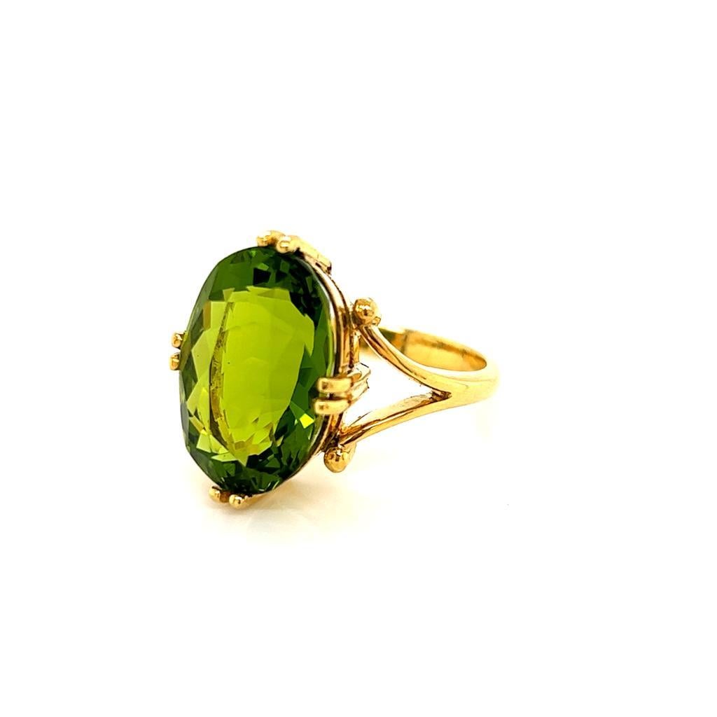 Contemporary 7.58 Carat Oval Peridot Handcrafted Solitaire Ring in 18 Karat Yellow Gold For Sale