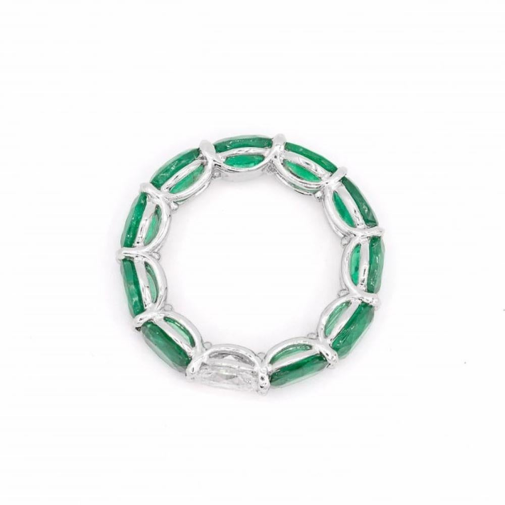 Contemporary 7.58ct Oval Shaped Emerald and Diamond Horizontally East West Eternity Band Ring For Sale