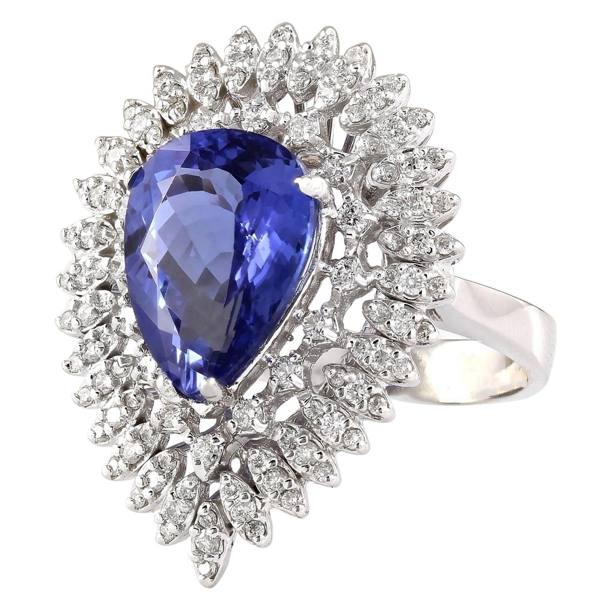 Indulge in luxury and sophistication with our exquisite 7.59 Carat Tanzanite Ring crafted in lustrous 14K White Gold. This opulent piece features a captivating pear-shaped tanzanite, weighing 6.09 carats and measuring 14.00x10.00 mm. Adorning the