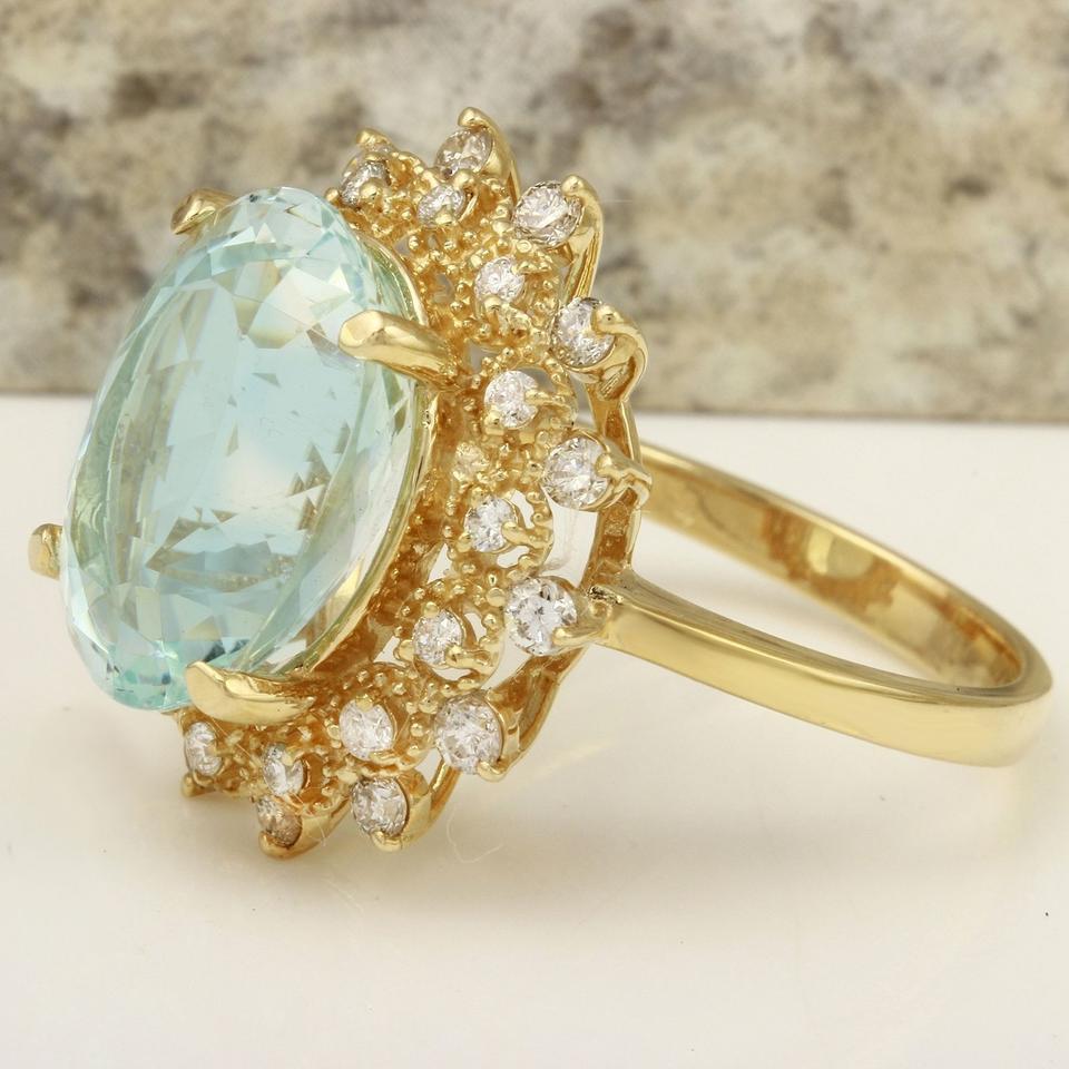 7.59 Carats Exquisite Natural Aquamarine and Diamond 14K Solid Yellow Gold Ring

Total Natural Aquamarine Weight is: Approx. 6.84 Carats

Aquamarine Measures: Approx. 14.18 x 10.39mm

Natural Round Diamonds Weight: Approx. 0.75 Carats (color G-H /