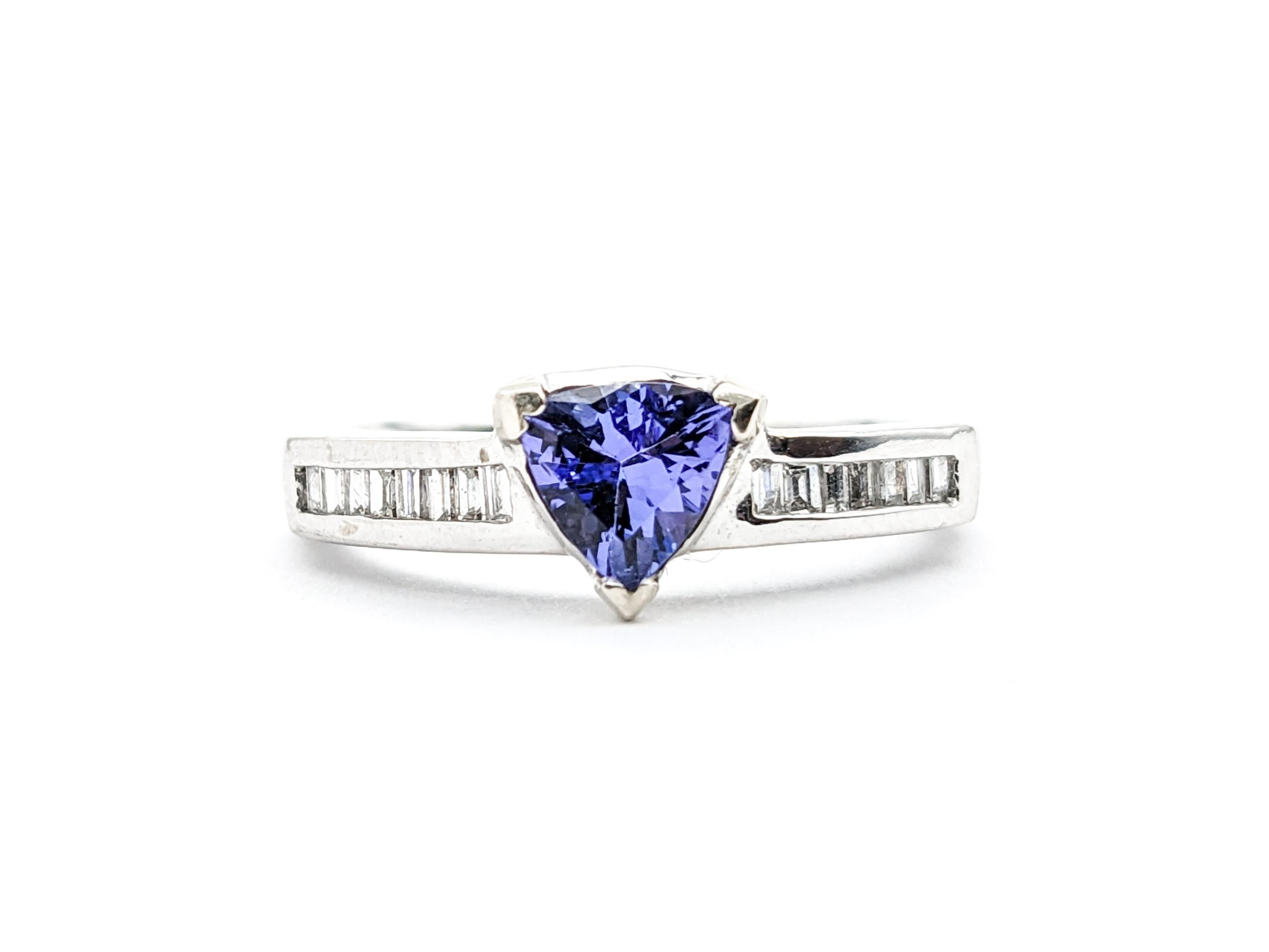 .75ct Blue Tanzanite & Diamonds Ring In White Gold

Discover the elegance of this stunning Tanzanite ring, meticulously fashioned from 14k White Gold. Central to its allure is a mesmerizing .75ct tanzanite with a rich blue-violet hue. Further