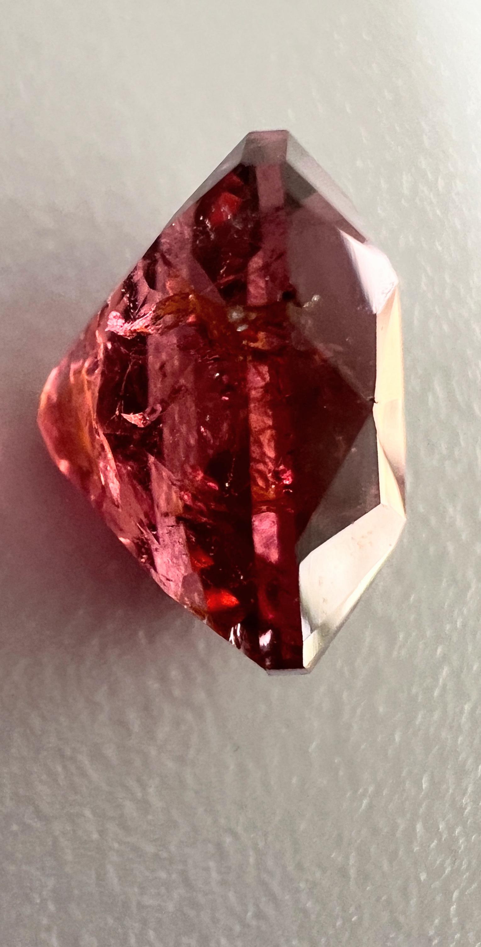 Immerse yourself in the allure of our 7.5ct Deep Pink Cushion Rubellite Gemstone, a jewel that exudes sophistication and warmth. The cushion cut, known for its rounded corners and large facets, maximizes the stone’s brilliance and depth of color,
