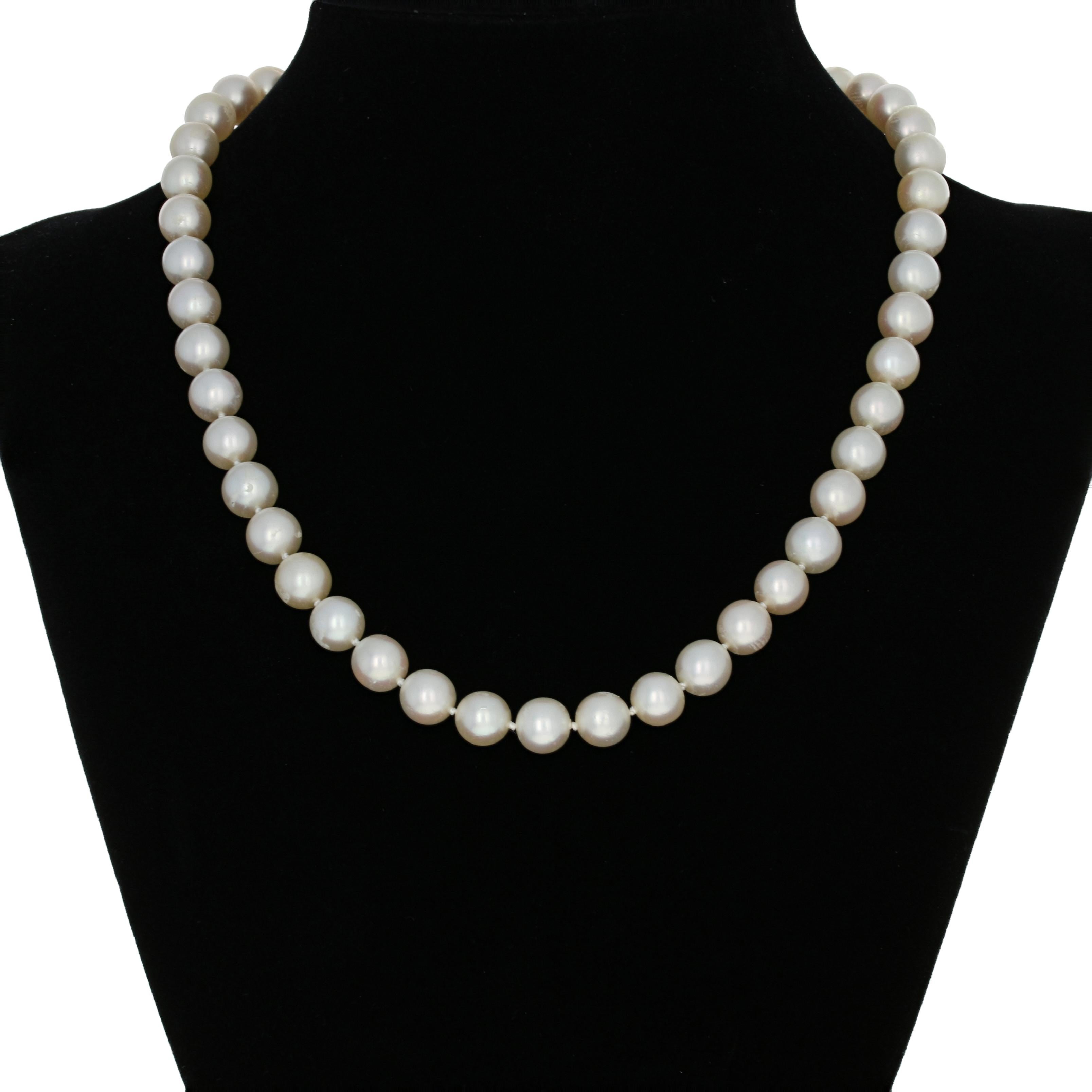 Metal Content: Guaranteed 14k Gold as stamped

Stone Information: 
Genuine Pearls
Diameter: 7.5mm
Quantity: 46

Natural Diamonds  
Clarity: VS2 - SI1 
Color: F - G  
Cuts: Baguette & Single 
Total Carats: 0.75ctw 

Necklace Style: Knotted