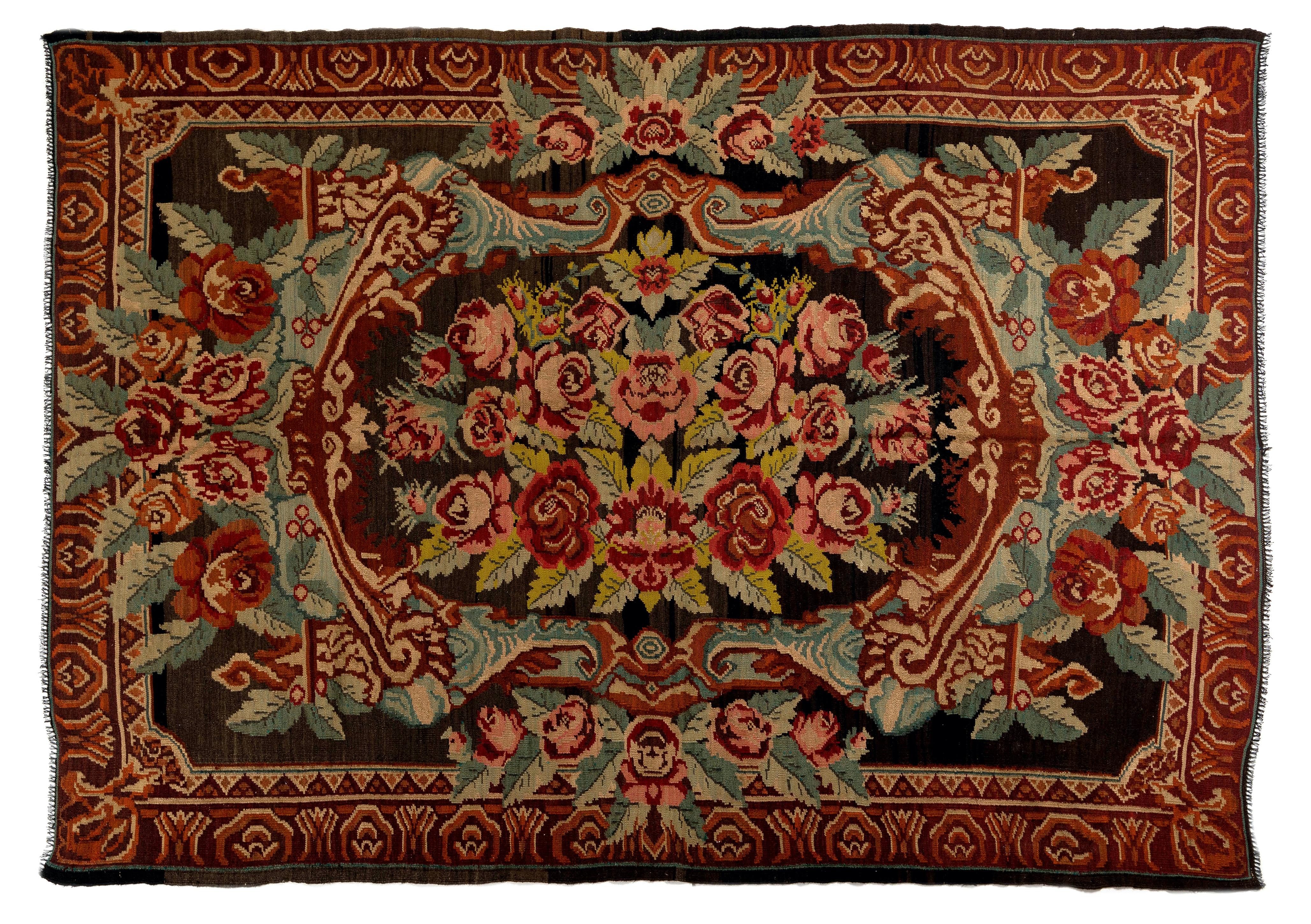 One of a kind vintage Bessarabian Kilim.
A handwoven Eastern European rug from Moldova. These traditional Moldovan flat-weaves are inspired from vintage Aubusson carpets but they are distinguished with their black grounds, large floral patterns in