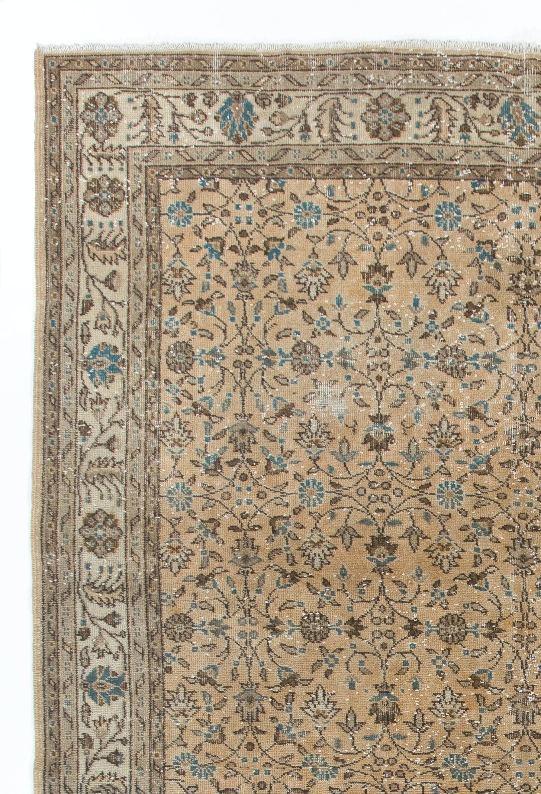 A finely hand-knotted vintage Turkish rug from 1960s featuring an all-over floral design.

The rug has even low wool pile on cotton foundation. It is heavy and lays flat on the floor. It is professionally washed, in very good condition with no