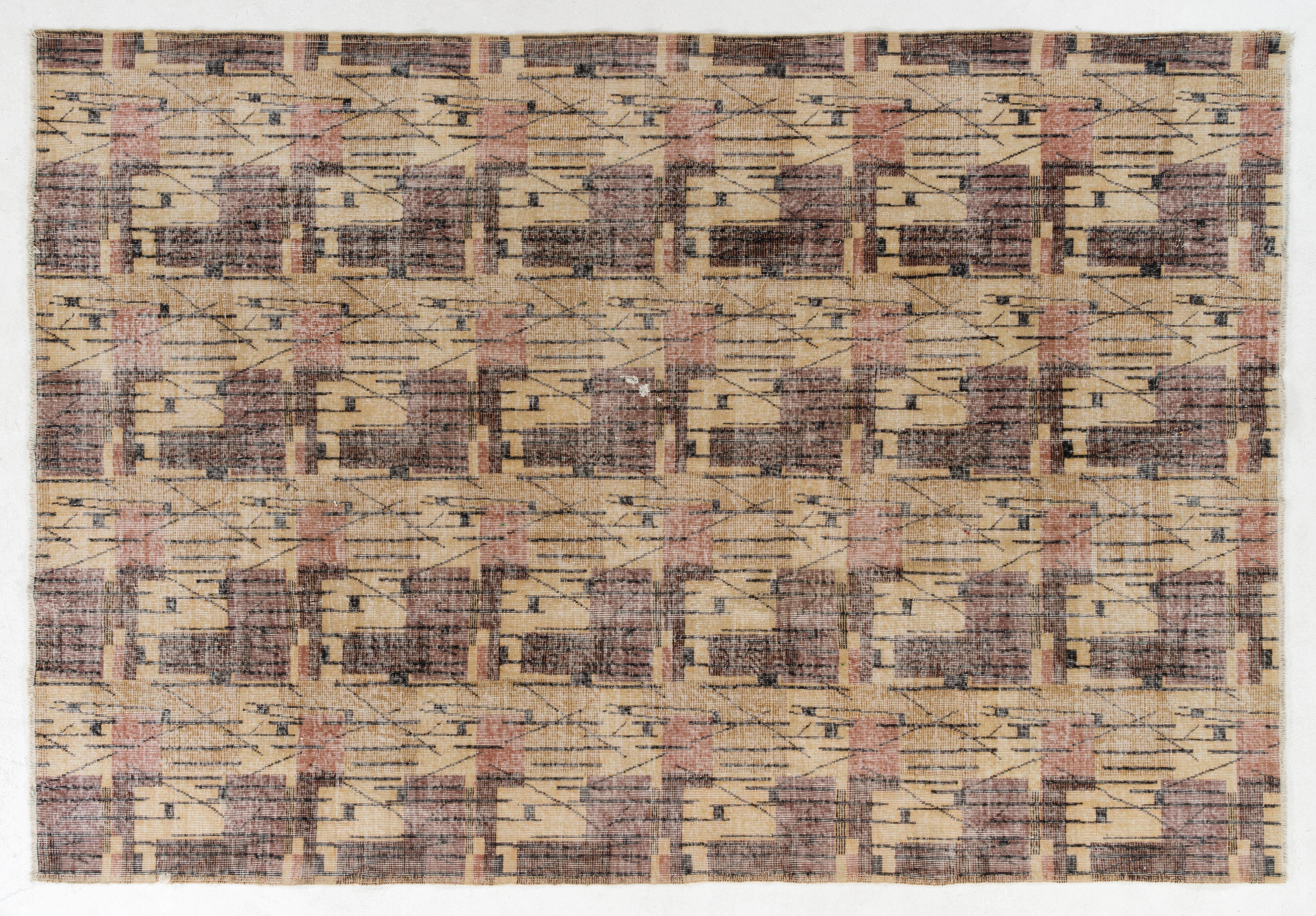 A rare Mid-Century Modern abstract Turkish rug designed by the famous singer/artist Zeki Muren,
(1931-1996). Measures: 7.5 x 11 Ft.