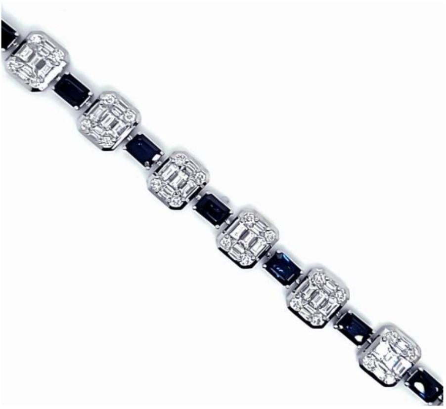 The Following Item we are offering is a Rare 18KT White Gold Large Baguette Diamond Blue Sapphire Bracelet. Bracelet is comprised of Finely Set Gorgeous Glittering Sapphires and Diamonds!! T.C.W. Approx 16CTS!! This Gorgeous Bracelet is a Rare