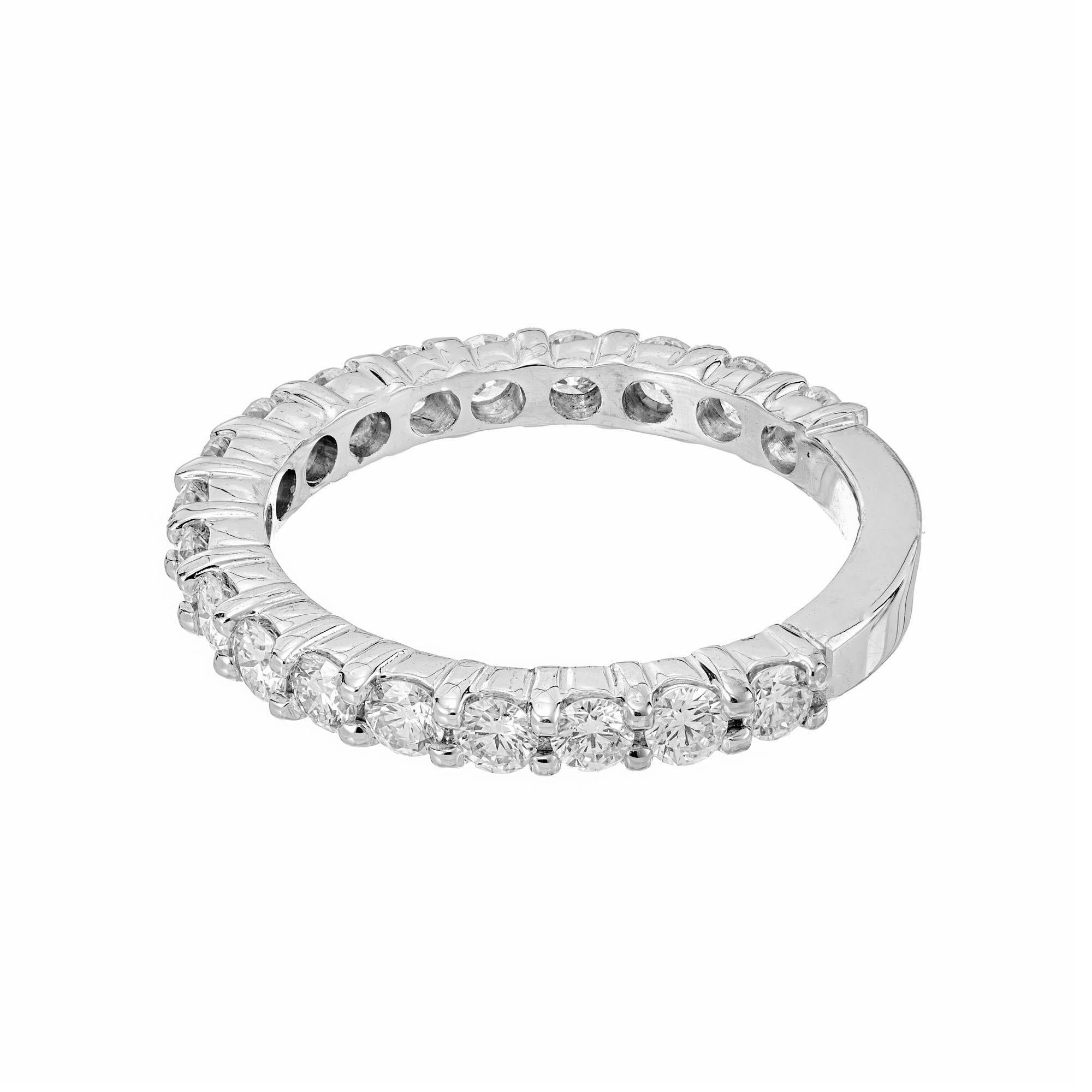 Diamond wedding band ring. 19 round brilliant cut diamonds in a 14k white gold common prong setting. White diamonds go 3/4 of a way around with a sizing bar at the bottom.

19 round brilliant cut diamonds, G VS SI approx. .76cts
Size 6 and