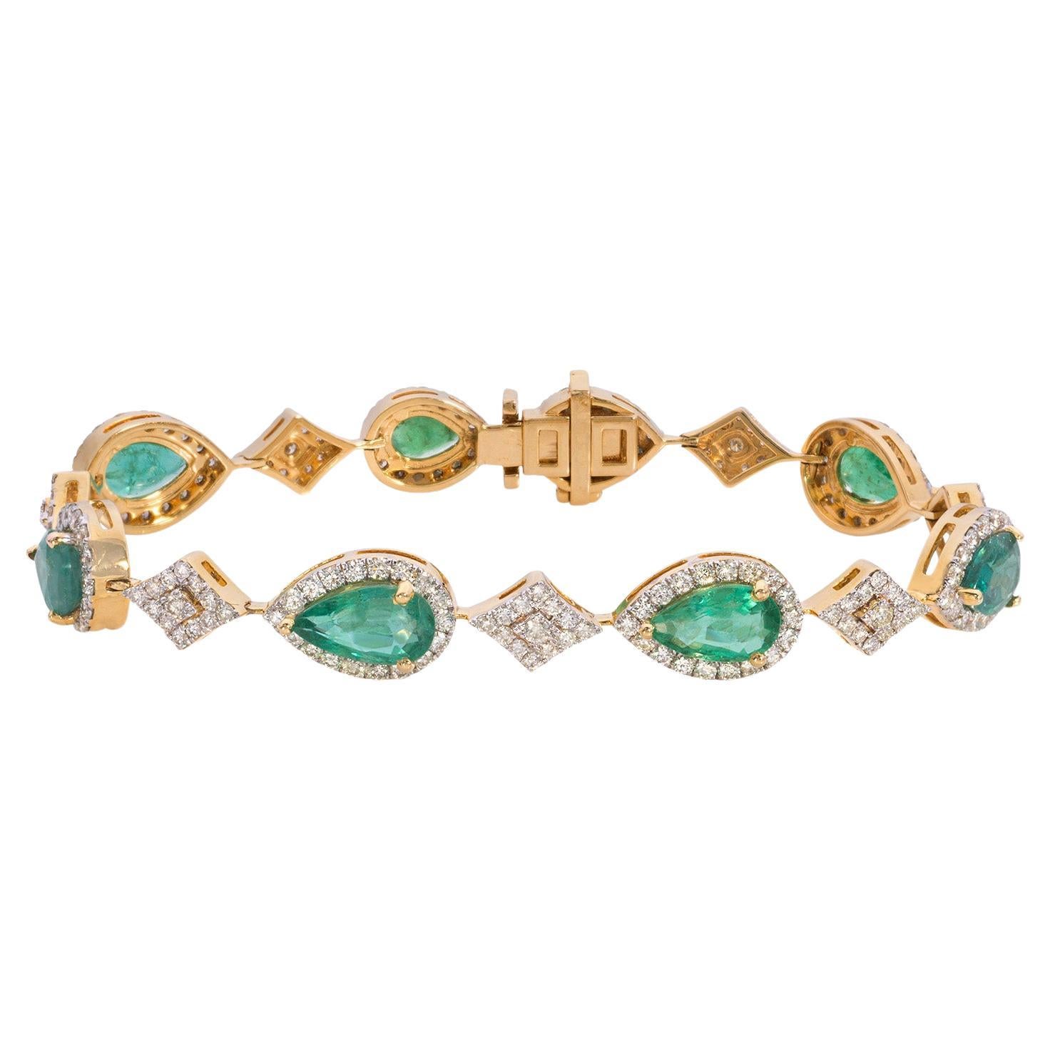 Indulge in the captivating allure of this stunning emerald and diamond bracelet, a true embodiment of elegance and luxury. Crafted in 18K yellow gold, this exquisite piece features a mesmerizing array of drop-shaped natural emeralds, each embraced