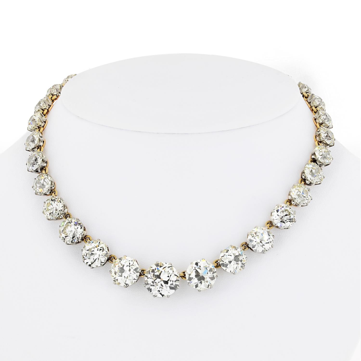 The vintage rivière necklace is crafted from a 18-karat gold. It's strung with thirty-two Old European-cut diamonds that shimmer in the light. 

Wear yours for your next event for a beautiful finishing touch.
Necklace length: 15 inches. 
Total carat