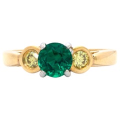 .76 Carat Round Emerald and .25 Carat Fancy Yellow Diamond 3 Stone 18k Gold Ring