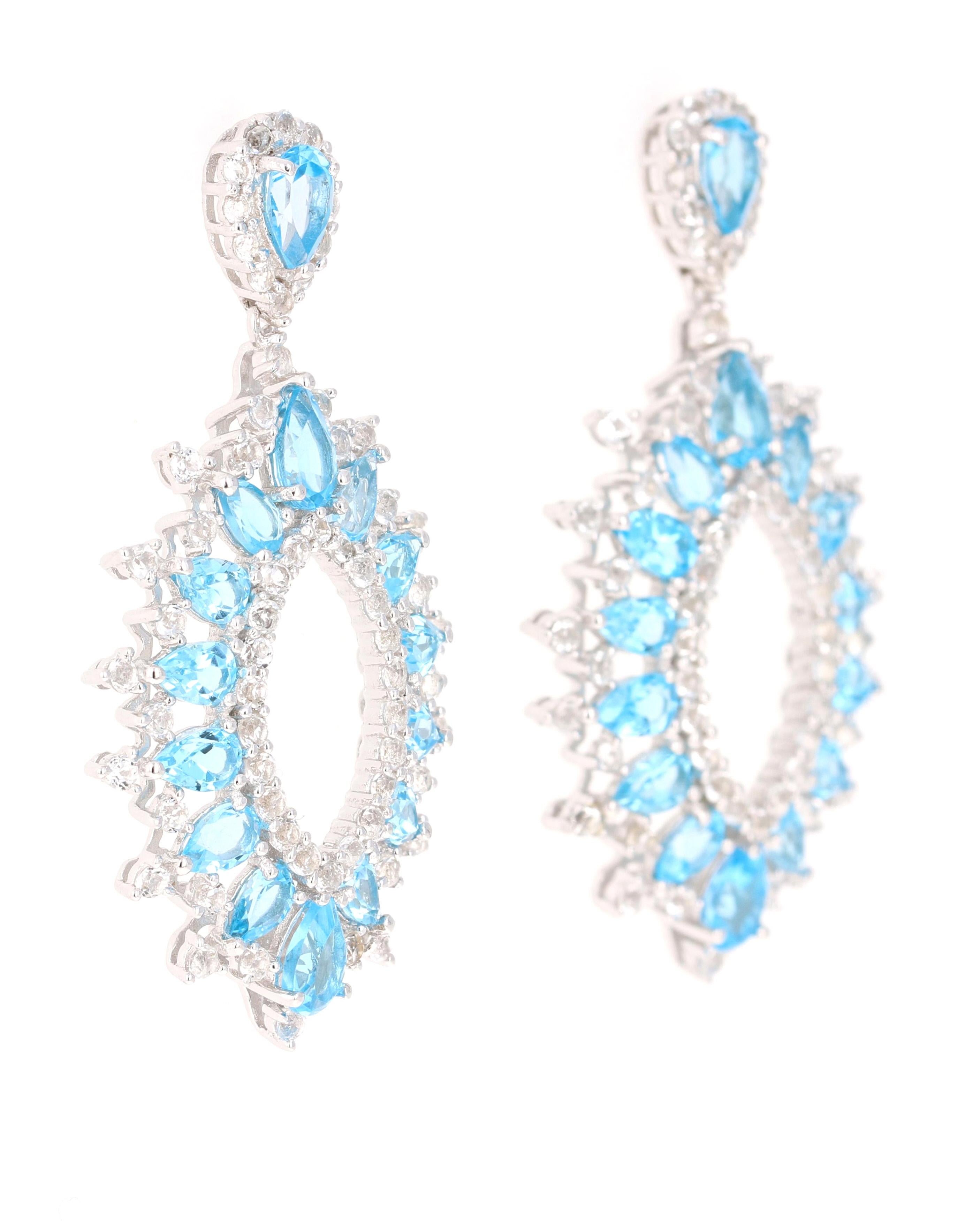 Stunning Dangle Earrings 

These earrings have 7.60 Carats of Blue Topaz and White Topaz.

They are beautifully curated in 925 Silver weighing approximately 11.6 grams 

They are 1.75 inches long. 

