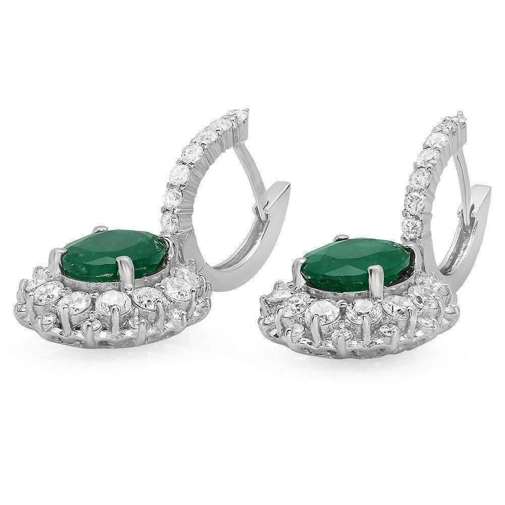 Superb 7.60 Carats Natural Emerald and Diamond 14K Solid White Gold Earrings

Amazing looking piece!

Total Natural Round Cut White Diamonds Weight: Approx. 2.60 Carats (color G-H / Clarity SI1-SI2)

Total Natural Oval Cut Emeralds Weight: Approx.