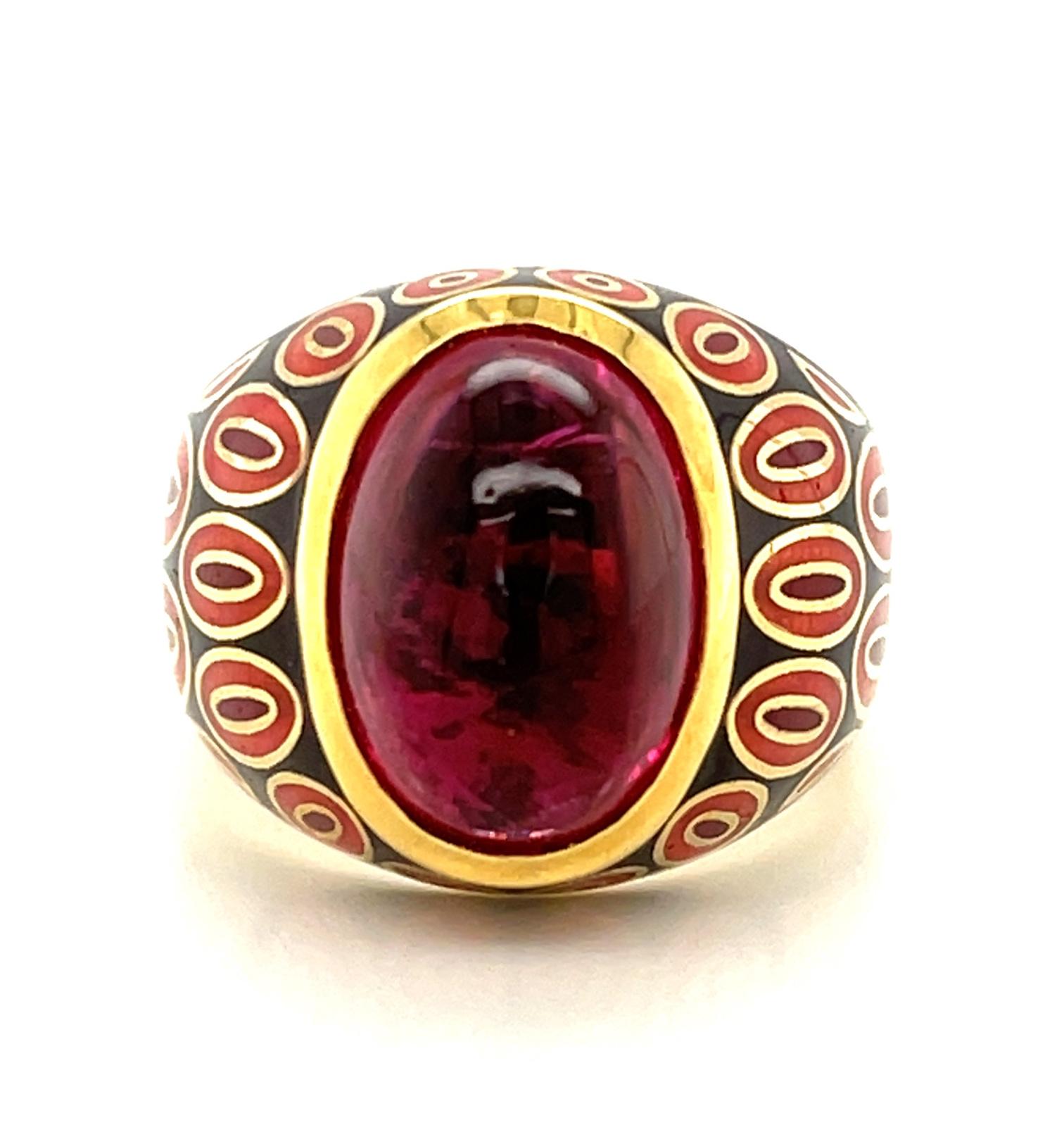 A fine quality, rich fuchsia-red rubellite tourmaline cabochon is featured in this 18k and enamel ring. This ring is serious and tailored with a funky spirit! The bold color and pattern combination of enameling complement the shape and the depth of