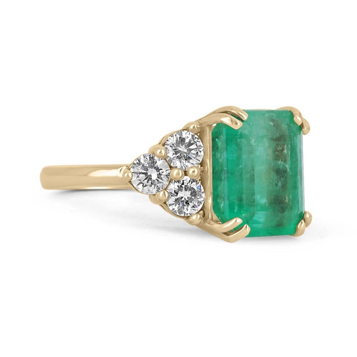 An iconic emerald and diamond engagement ring. The center stone features a large 6.68-carat emerald cut Colombian emerald with stunning qualities; a vivacious medium green color, very good eye clarity and luster, as well as very minimal inclusions