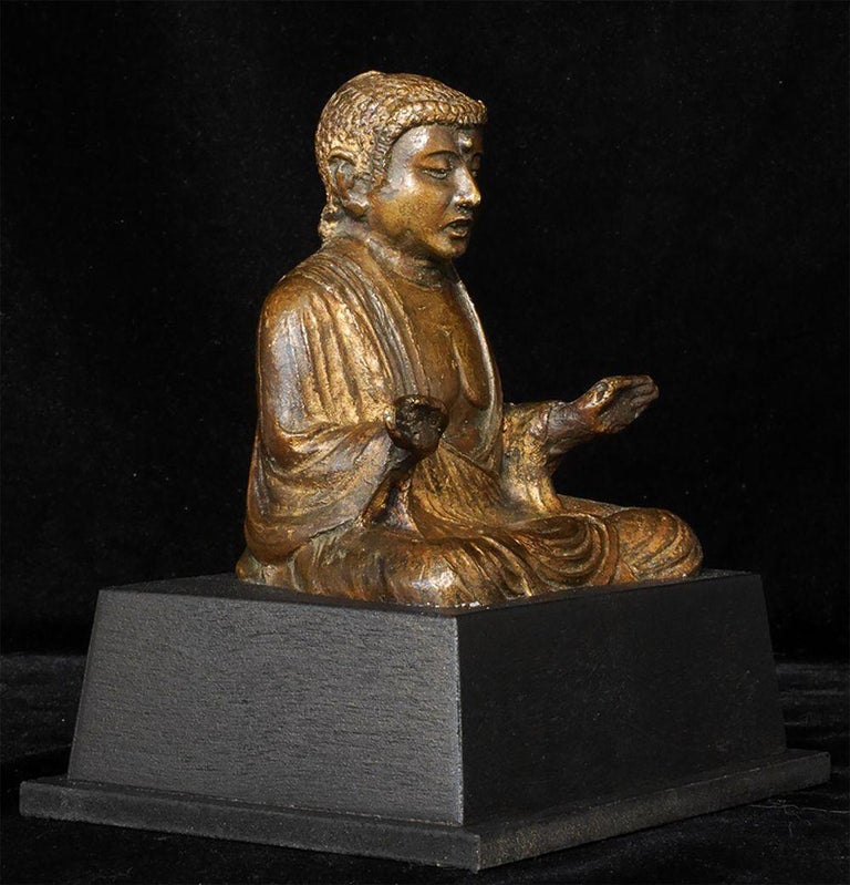 Antique Korean or Japanese Buddha-sits 4 inches tall, 6 inches on custom base. Solid-cast, and is very heavy for its size. Bottom says 