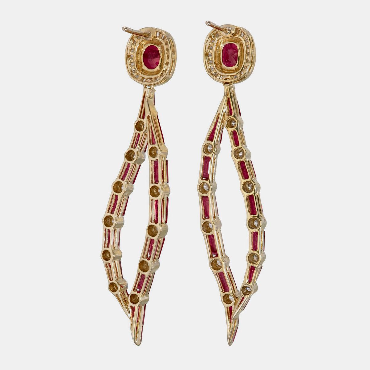 A vibrant and sophisticated ruby and diamond chandelier earrings presented to you by Rewa jewels in 18 karat white gold.

This piece is decorated with 2 pieces of Burma rubies weighing approximately 2.15 carat total and tapper ruby 28 pieces