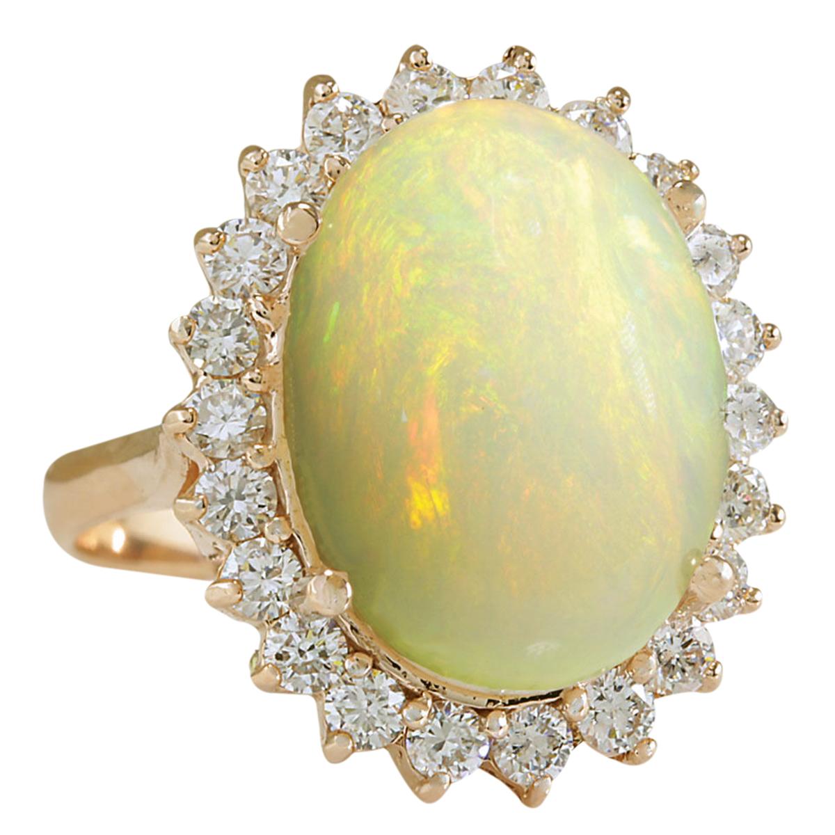 7.64 Carat Natural Opal 14 Karat Rose Gold Diamond Ring
Stamped: 14K Rose Gold
Total Ring Weight: 6.0 Grams
Total Natural Opal Weight is 6.44 Carat (Measures: 16.00x12.00 mm)
Color: Multicolor
Total Natural Diamond Weight is 1.20 Carat
Color: F-G,