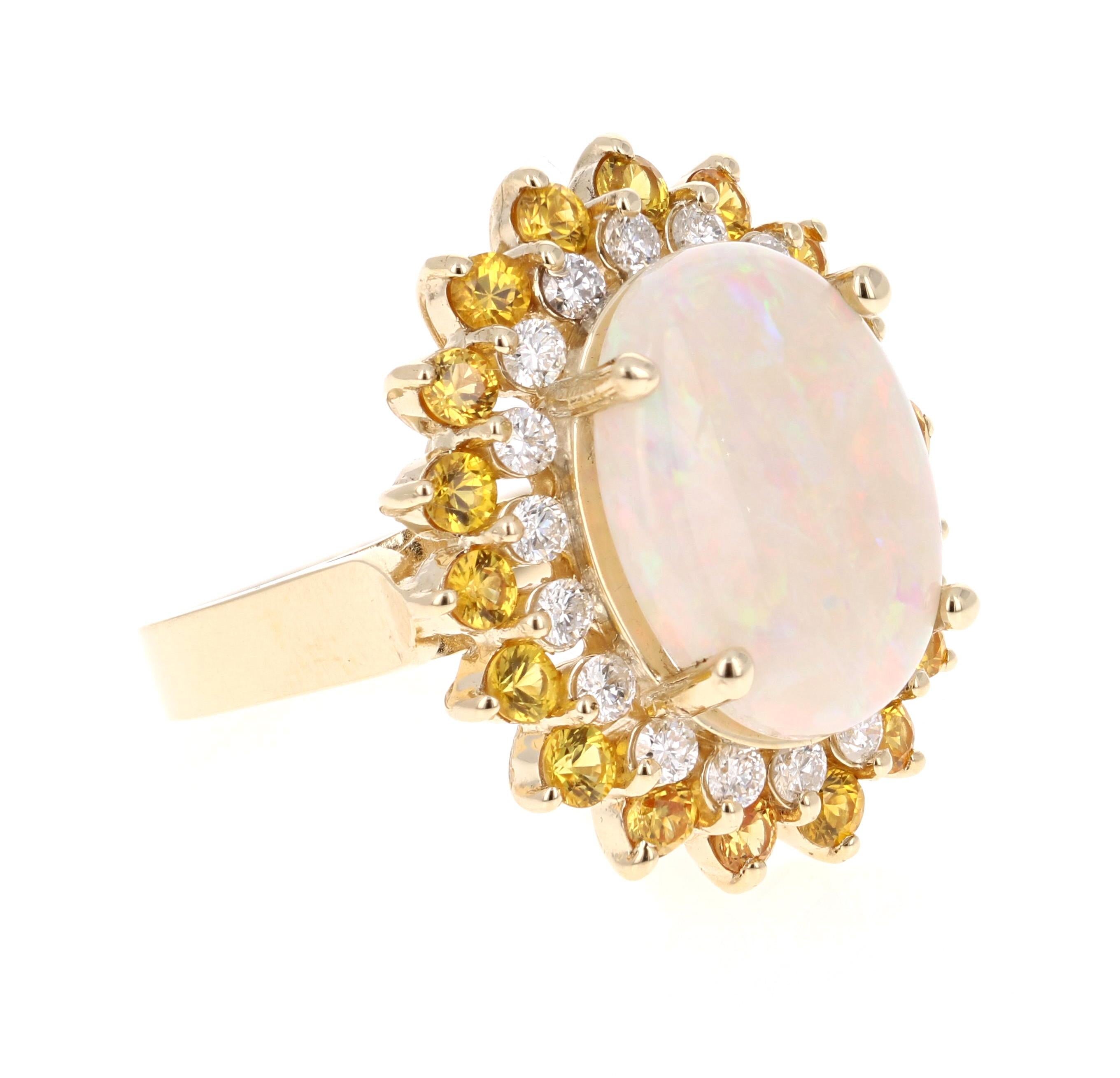 Gorgeous and uniquely designed Opal and Diamond Ring with a vibrancy of Yellow Sapphires!

This stunning piece has a 5.47 carat opulent Opal set in the center of the ring.  The Opal is surrounded by a row of  18 Round Cut Diamonds that weigh 0.68