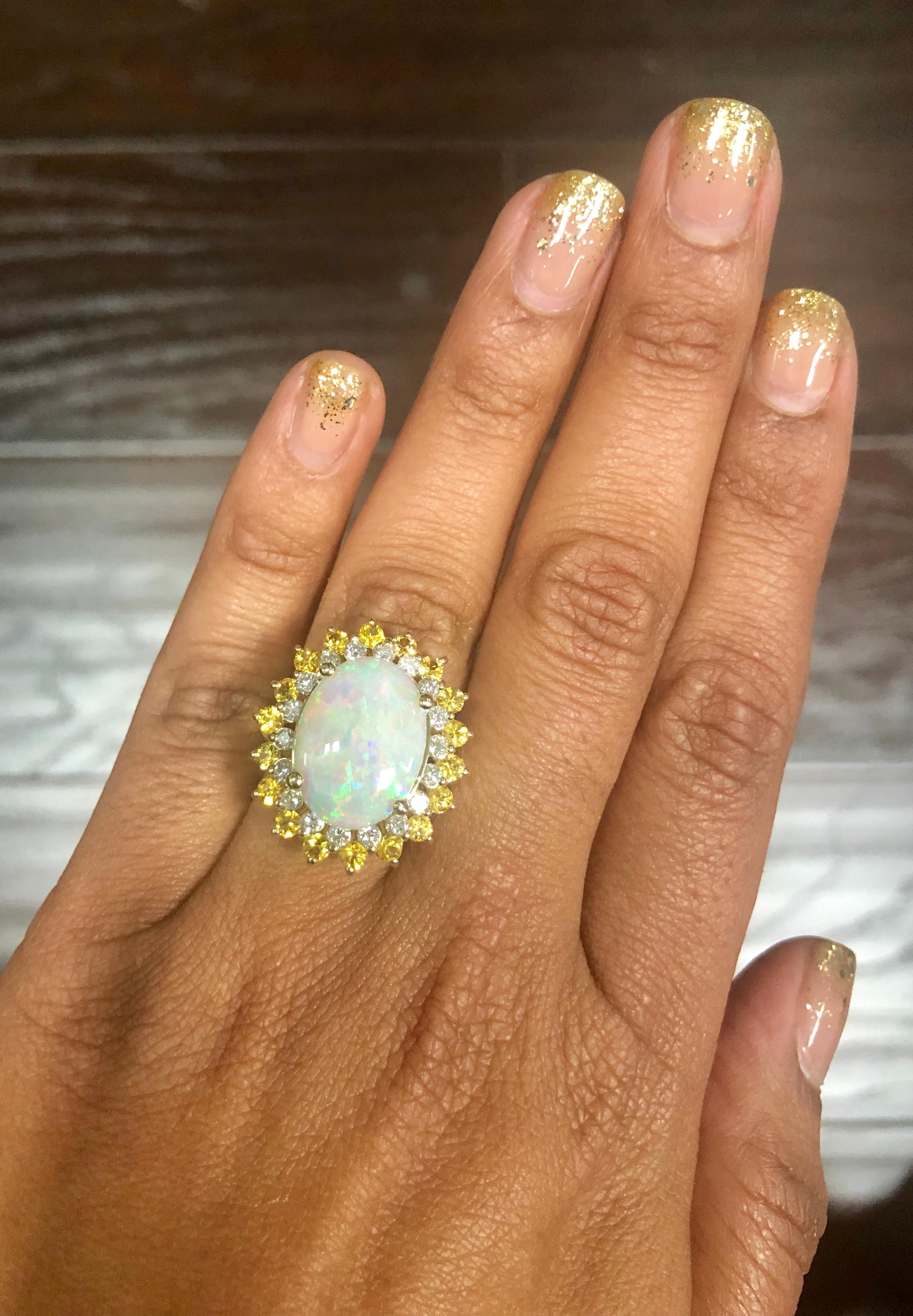 Oval Cut 7.64 Carat Opal Yellow Sapphire and Diamond 14 Karat Yellow Gold Cocktail Ring For Sale