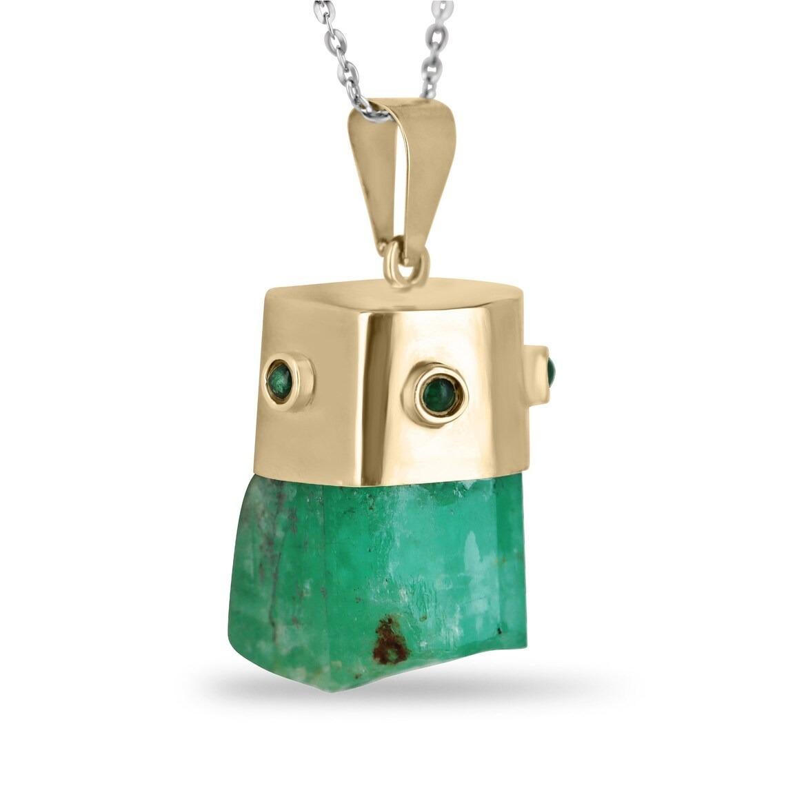 Showcased is a natural, rough emerald crystal pendant. An estimated 76 total carat weight of genuine, rough, Colombian emerald crystal is beautifully set in a hand-made 14K yellow gold cap. The Colombian emerald has a rich, medium-green color and
