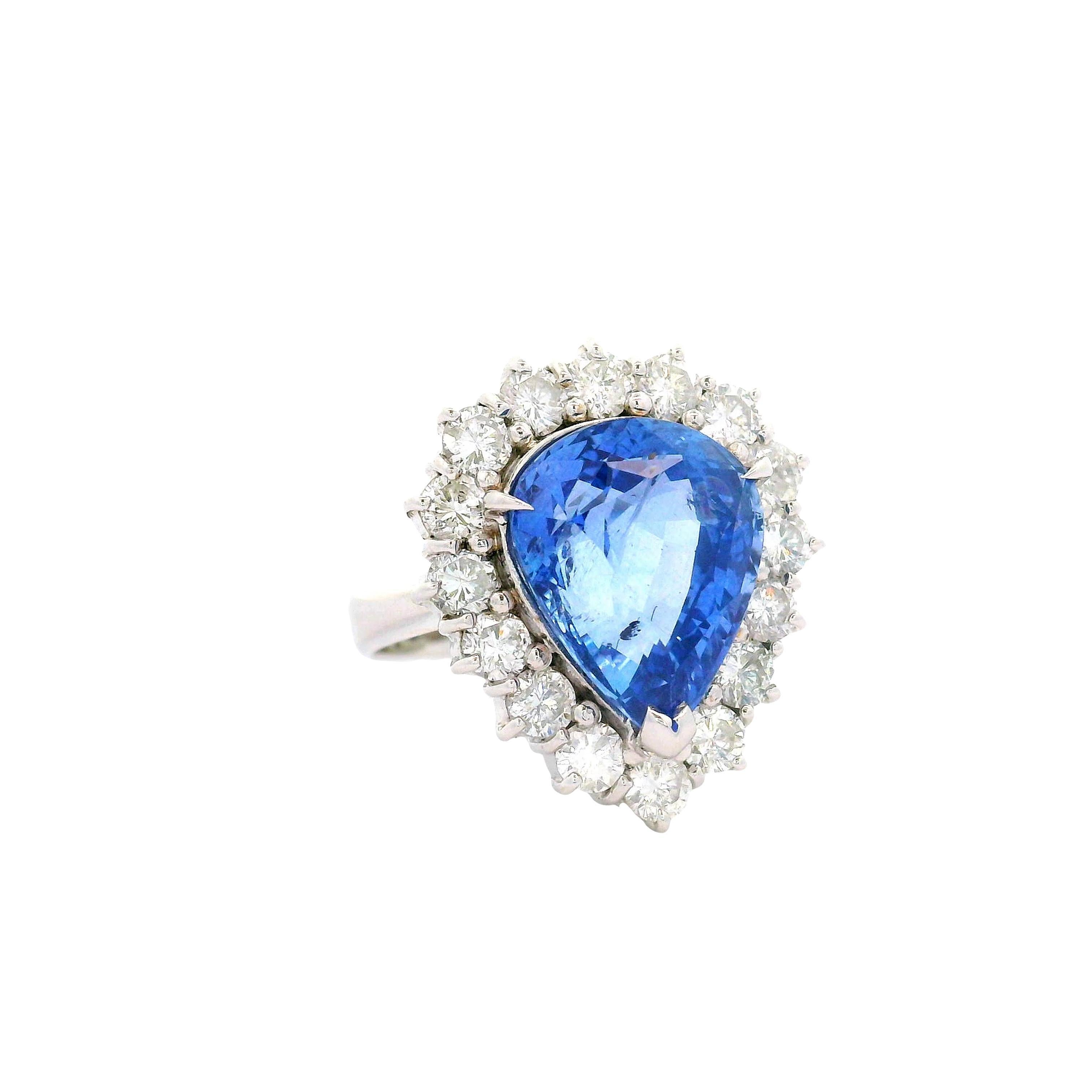 Contemporary 7.67 Carat Blue Sapphire Diamond Halo 18K White Gold Ring For Sale