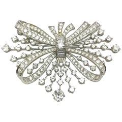 7.67 Carat Round and Baguette Diamond Platinum Spray Bow Brooch