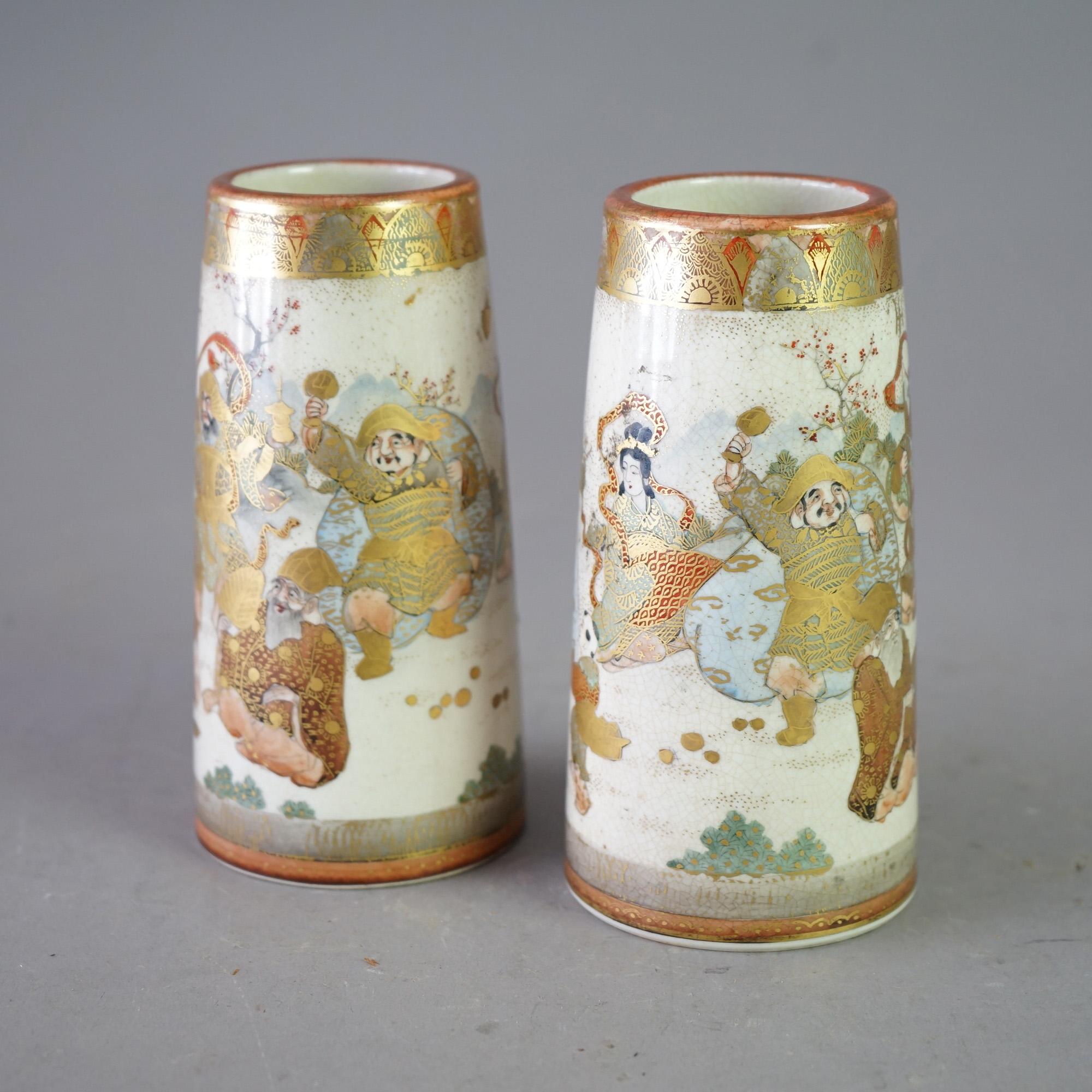 An antique pair of Meiji Satsuma vases offers porcelain construction with hand painted figures and gilt highlights throughout, bases stamped as photographed, c1900

Measure - 6