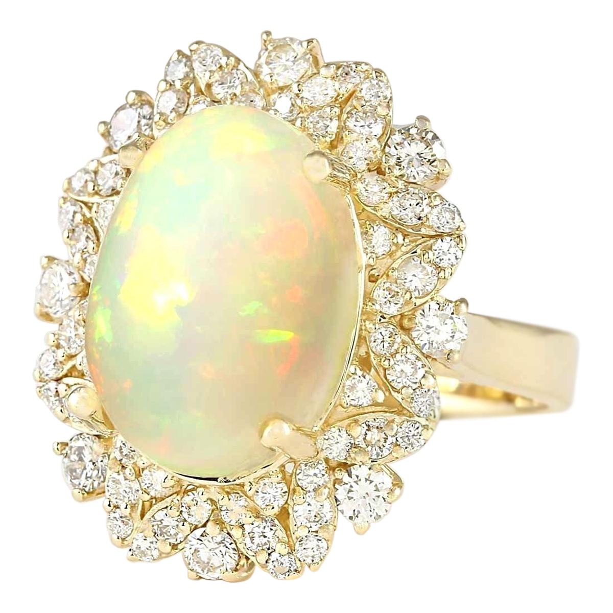 Stamped: 14K Yellow Gold
Total Ring Weight: 8.8 Grams
Total Natural Opal Weight is 6.48 Carat (Measures: 14.00x10.00 mm)
Color: Multicolor
Total Natural Diamond Weight is 1.20 Carat
Color: F-G, Clarity: VS2-SI1
Face Measures: 23.15x19.15 mm
Sku: