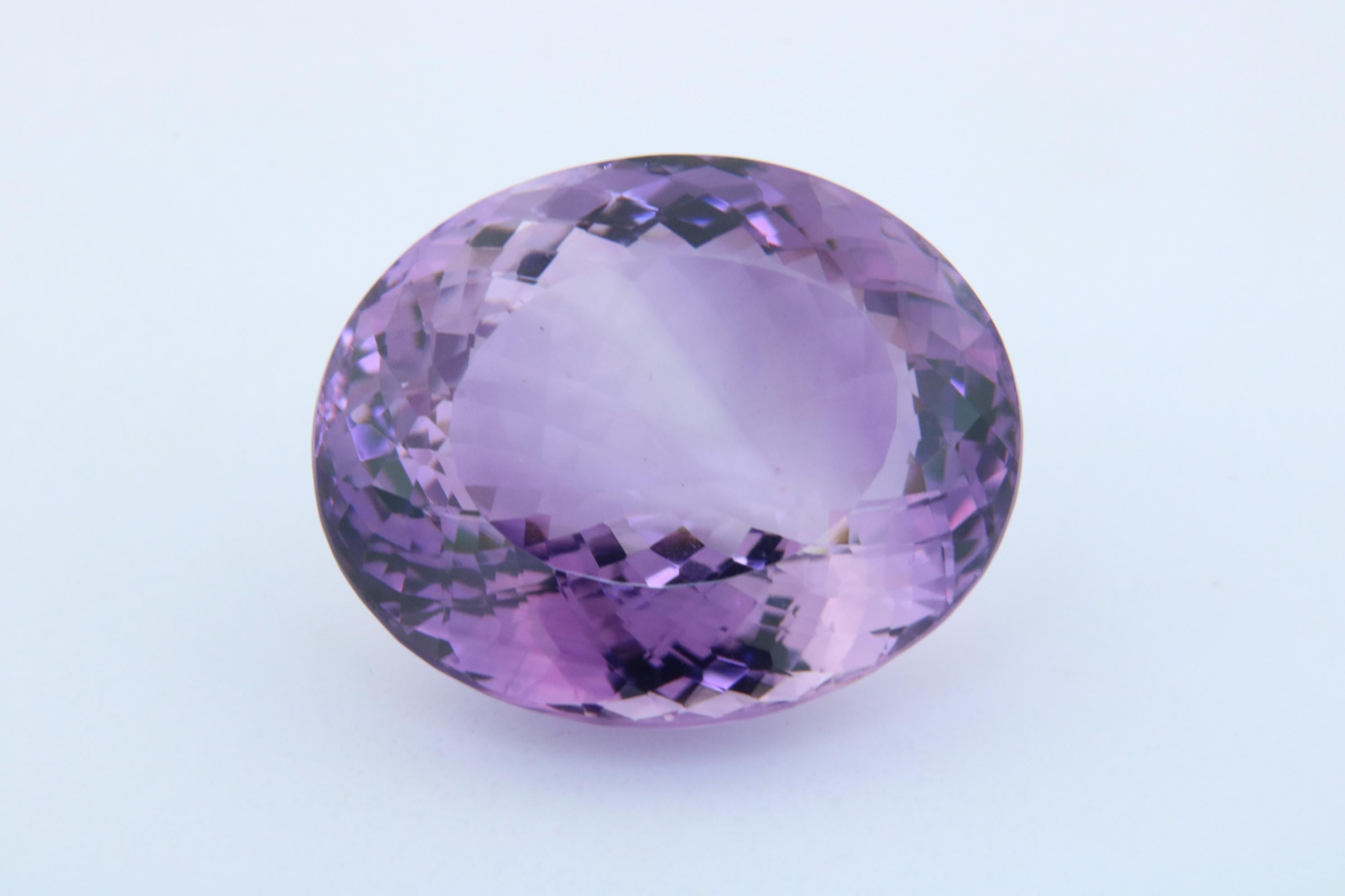 A collector's 76.81 carat, Radiant-Cut Amethyst Gem.

Shape: Oval
Crown: Spiral
Pavilion: Spiral
Dimensions: 30.48 x. 25.62 x 17.00 mm
Color: Purple
Weight: 76.81 Carats

No Heat/Treatment

This stone is available for direct purchase or for the